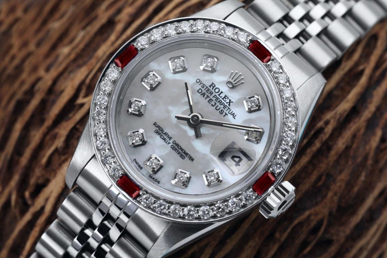 Rolex White Pearl 26mm Datejust SS Diamond & Ruby Bezel Ladies Watch 69160
This watch is in like new condition. It has been polished, serviced and has no visible scratches or blemishes. All our watches come with a standard 1 year mechanical warranty