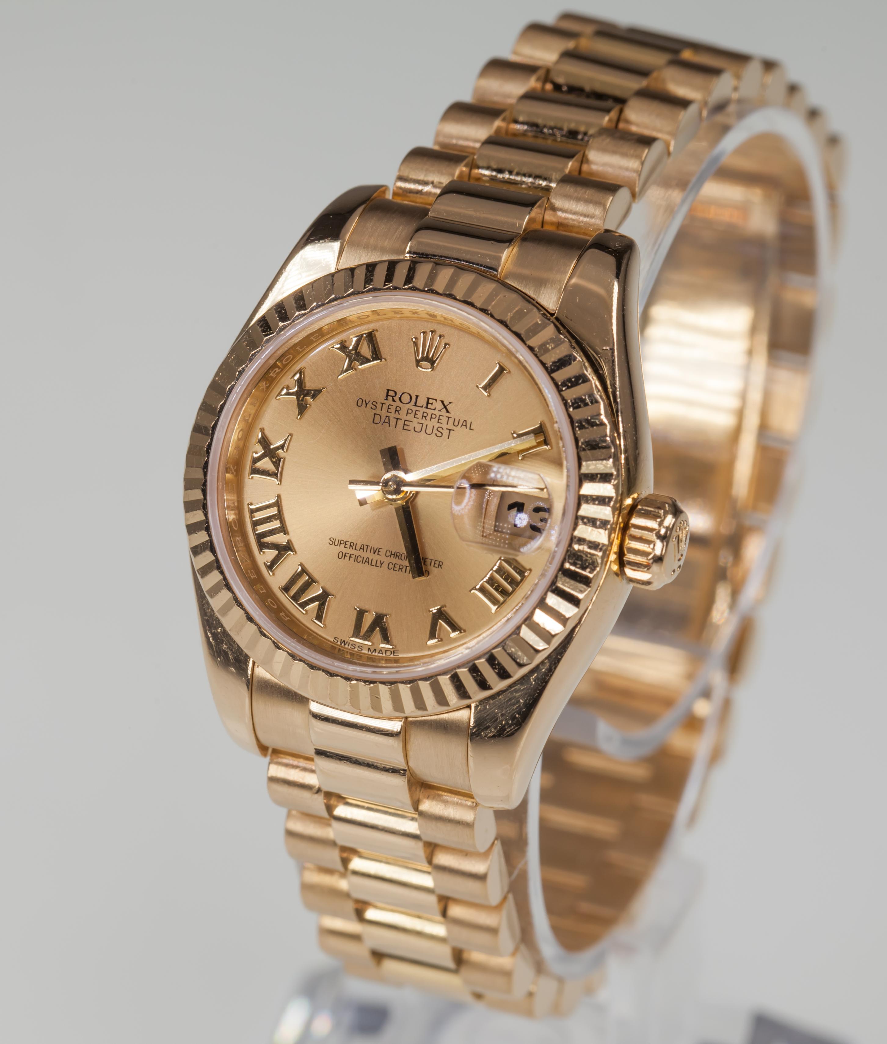 Rolex Women's 18k Yellow Gold President OPDJ Automatic Watch 179178
Model: Oyster Perpetual Datejust (President)
Model #179178
Serial #Z3931XX
Movement #2235-A1993455
18k Yellow Gold Case w/ Fluted Bezel
26 mm in Diameter (28 mm w/ Crown)
Lug-to-Lug