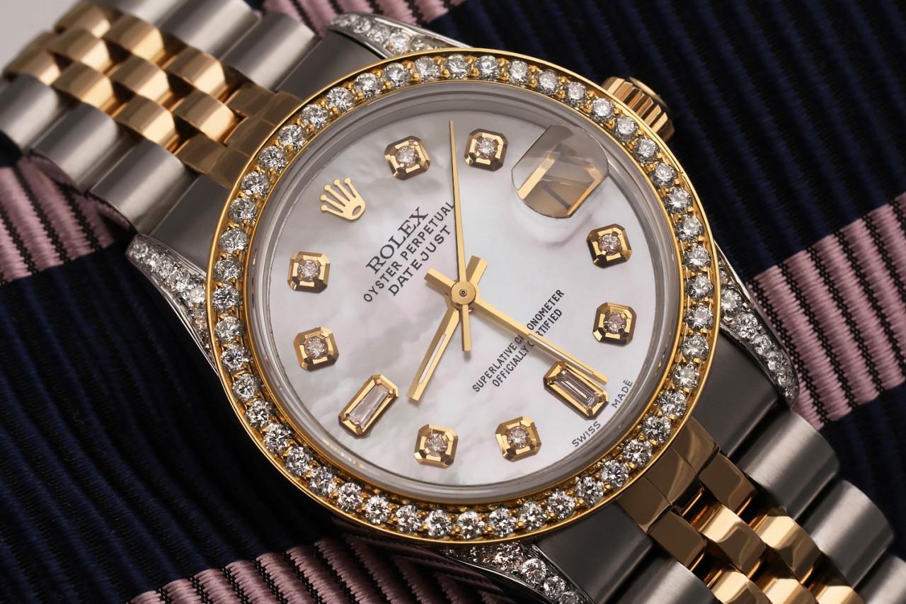 Women's Rolex 31mm Datejust Two Tone Diamond Bezel & Lugs White MOP Mother Of Pearl with 8 + 2 Accent 68273

This watch is in like new condition. It has been polished, serviced, and has no visible scratches or blemishes. All our watches come with a