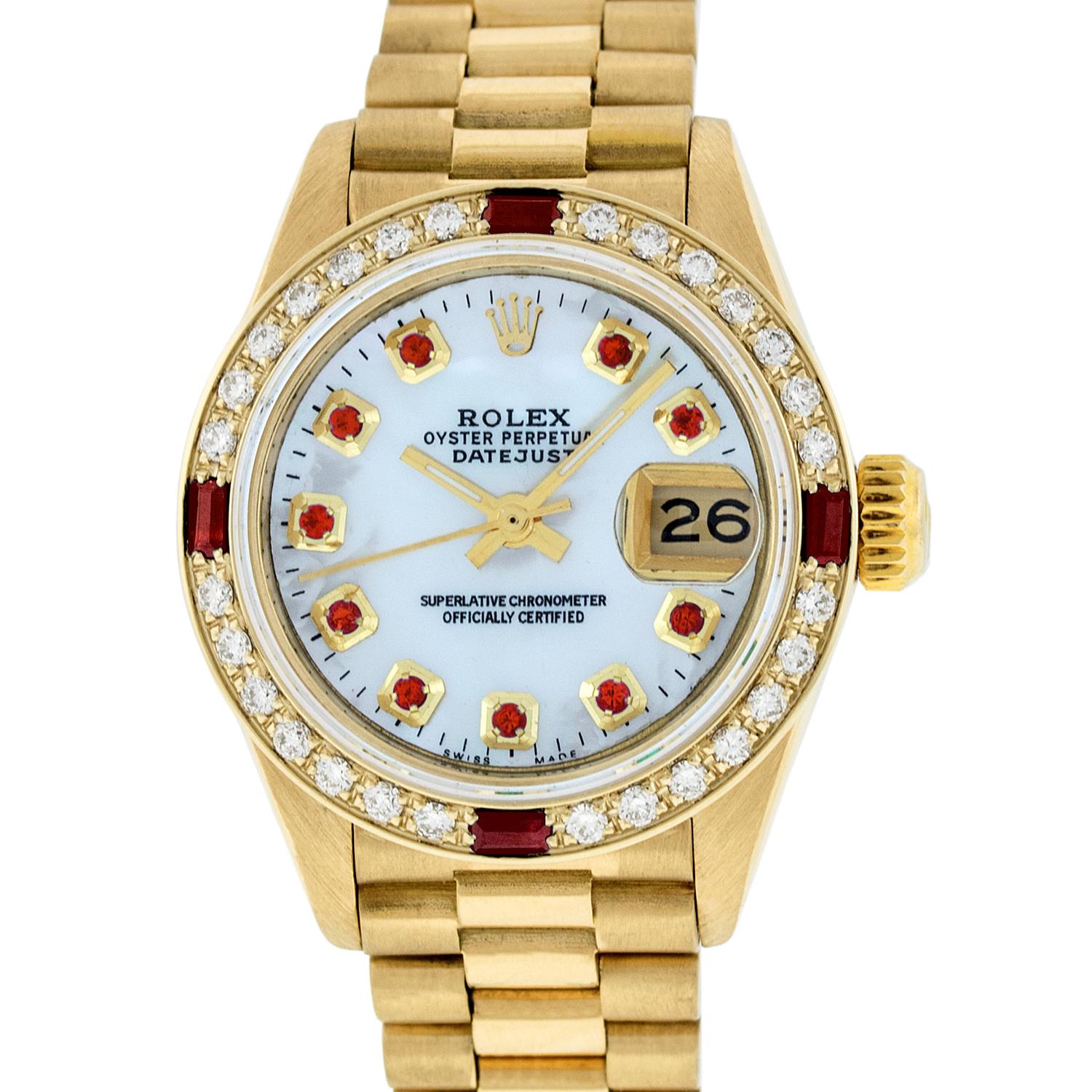 WATCH DESCRIPTION
 
BRAND : Rolex
MODEL : Datejust
CASE SIZE : 26mm
CASE : Rolex 18K Yellow Gold Case
GENDER : Women's

WATCH FEATURES
 
DIAL : Rolex Professionally Refinished Mother of Pearl Dial set with aftermarket Genuine Ruby Hour Markers
BEZEL