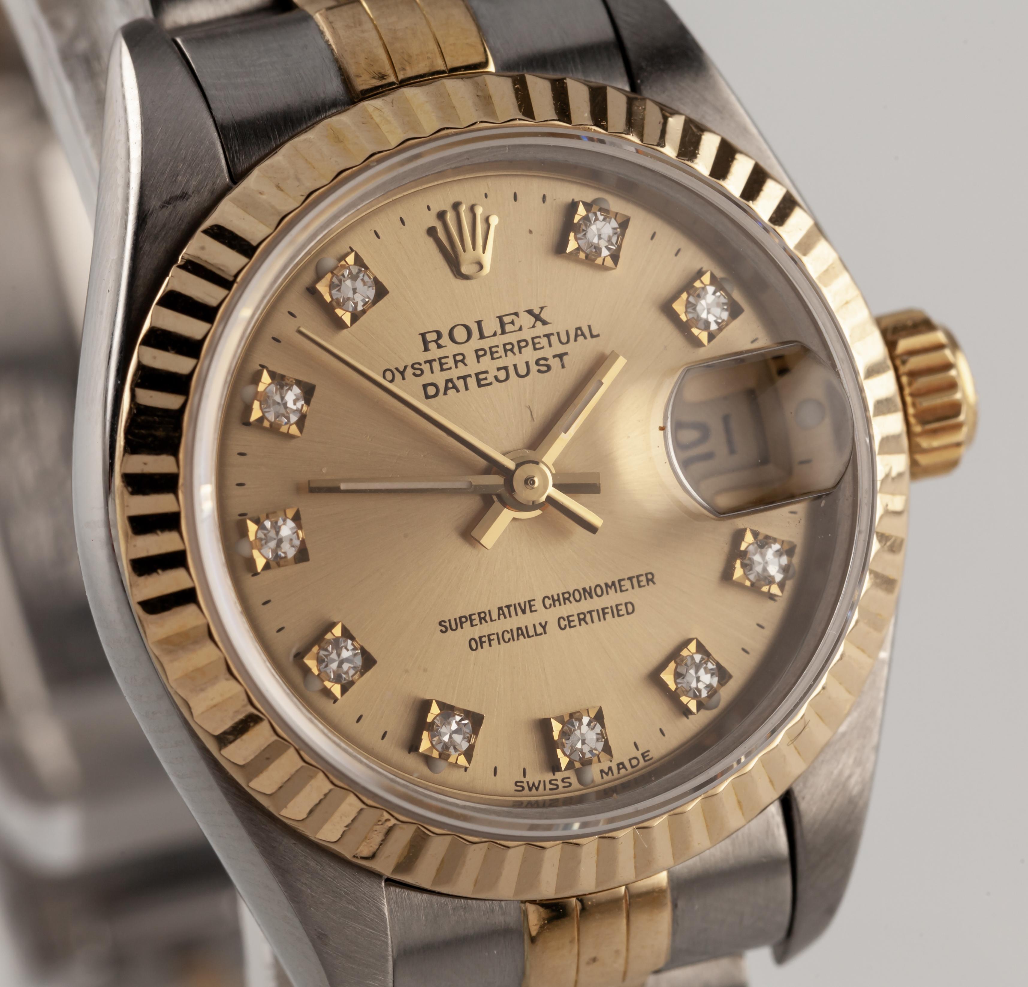 Rolex Women's Two-Tone Datejust w/ Diamond Dial Jubilee Band 69173
Model #69173
Serial #X6097XX
Movement #2135
Movement Serial #25875XX
Year: 1991
Stainless Steel Round Case with Fluted Gold Bezel
26 mm in Diameter (27 mm w/ Crown)
Lug-to-Lug Width