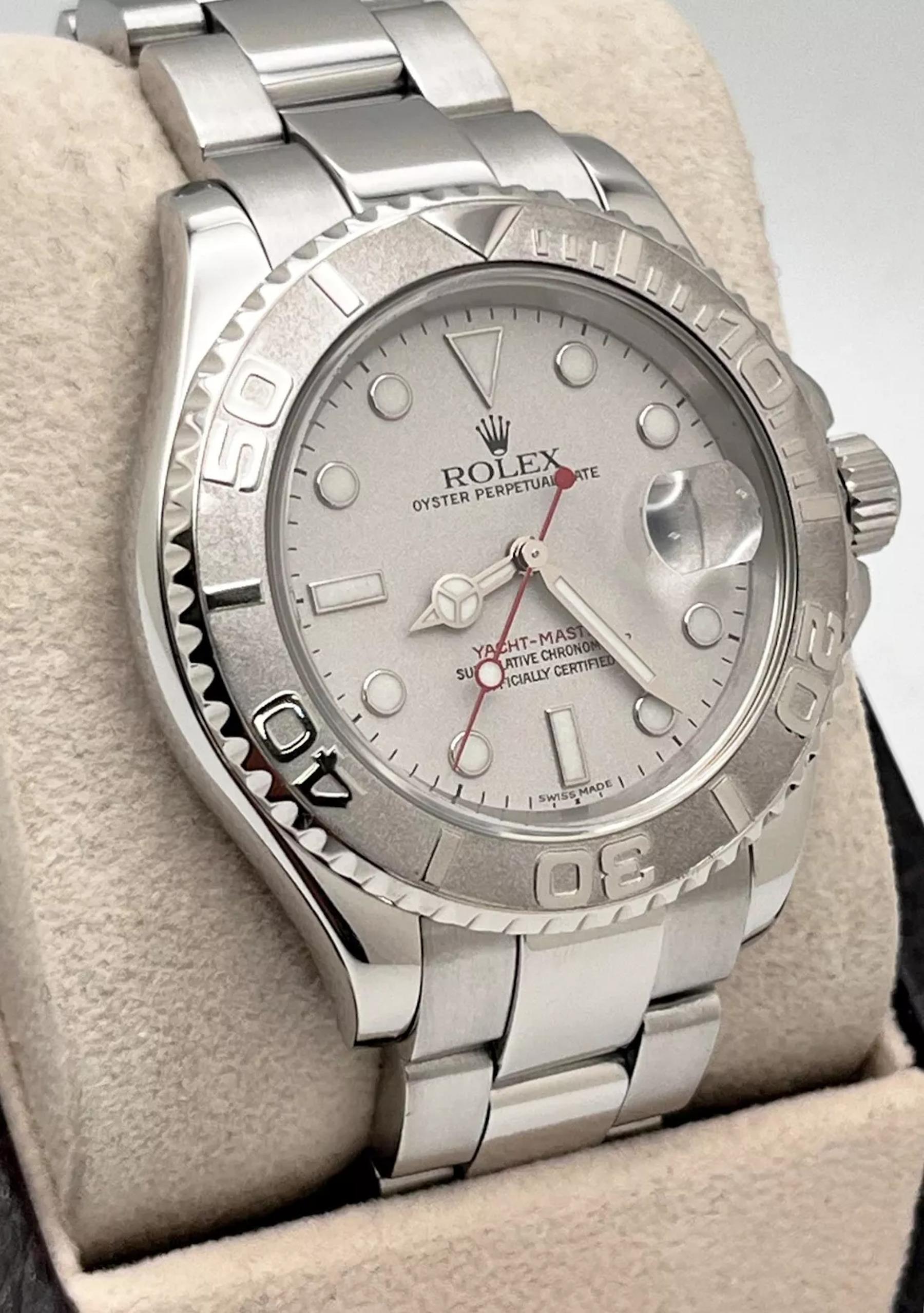 Style Number: 16622
Serial: A617***
Year: 1999
Model: Rolex Yacht Master
Case Material: Stainless Steel
Band: Stainless Steel
Bezel: Platinum
Dial: Silver
Face: Sapphire Crystal
Case Size: 40mm
Includes: 
-Elegant Watch Box
-Certified Appraisal 
-1