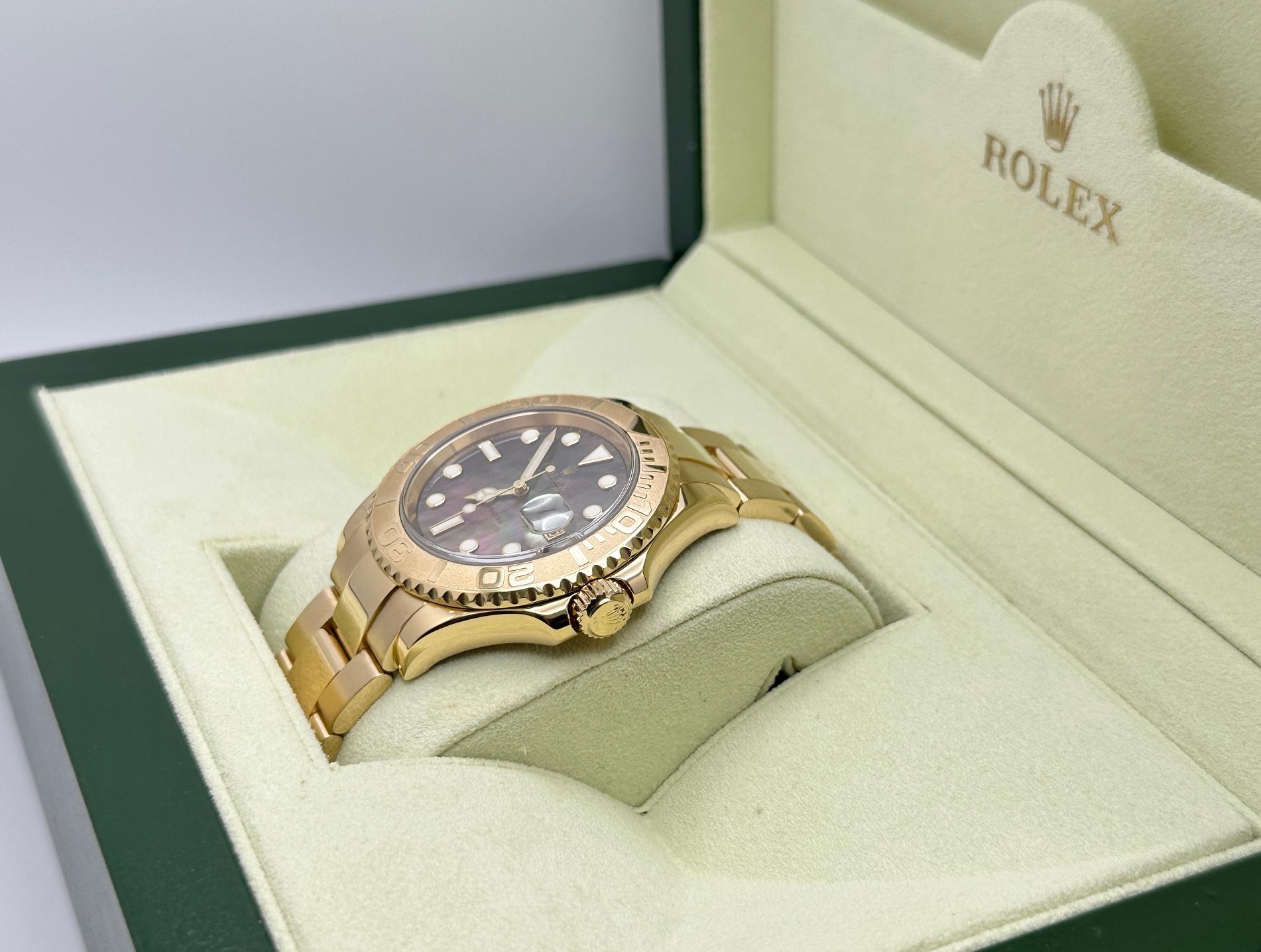 Rolex Yacht Master 16628 40mm Black MOP Dial 18K Yellow Gold Box Papers In Excellent Condition For Sale In San Diego, CA