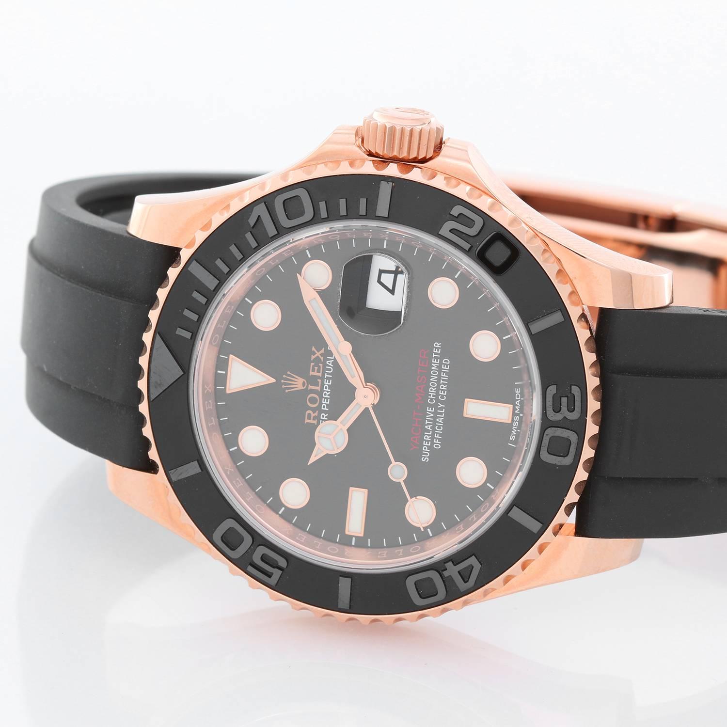 Rolex Yacht-Master 18k Everose Gold Men's Watch 116655 -  Automatic winding. 18k rose gold case and rotating bezel with black insert (40mm diameter). Black dial with luminous style white hour markers. Black rubber strap band with 18k rose gold