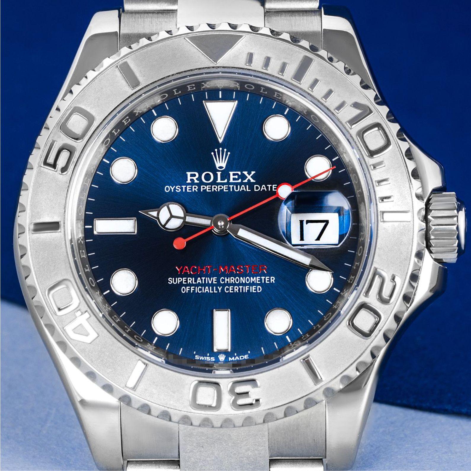 A 40mm Yacht-Master in stainless steel by Rolex. Featuring a bright blue dial with a date aperture and a platinum bi-directional rotatable bezel, with raised 60-minute numerals and graduations.

Fitted with scratch-resistant sapphire crystal and a