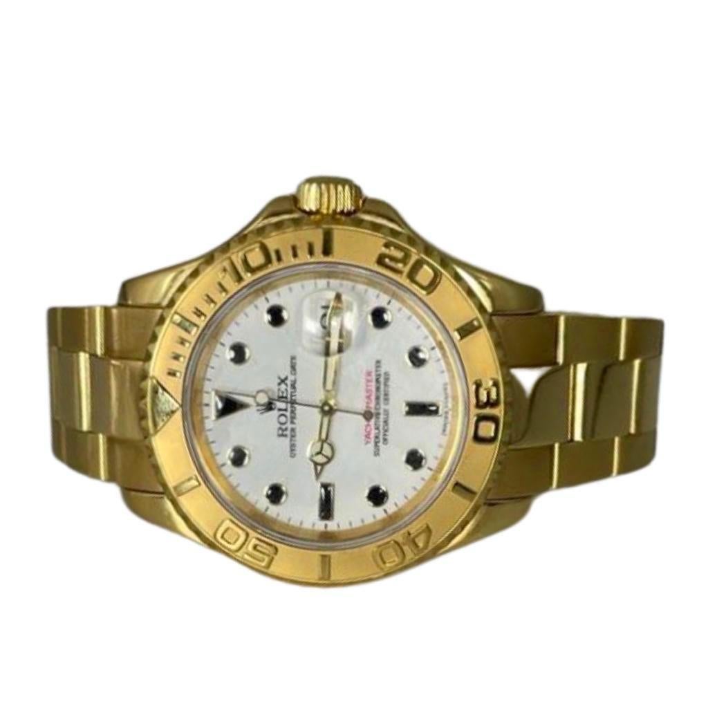 Brand: Rolex 

Model Name: Yacht Master

Model Number: 16628B

Movement: Automatic

Case Size: 40  mm

Case Back: Closed 

Case Material:  18k Yellow Gold 

Bezel: Relief

Dial: White

Bracelet: 18k Yellow Gold

Hour Markers: Dots

Features: Hours,