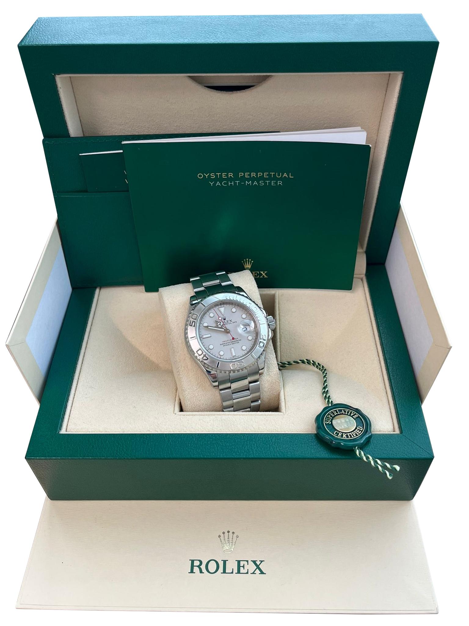 RolexYacht-Master 40mm, Stainless Steel and Platinum Watch. Platinum Dial with silver-tone, sword, and Breguet-style shape hands. Dots and index hour markers at the 6 and 9 o'clock positions. Minute markers around the outer rim. The watch has