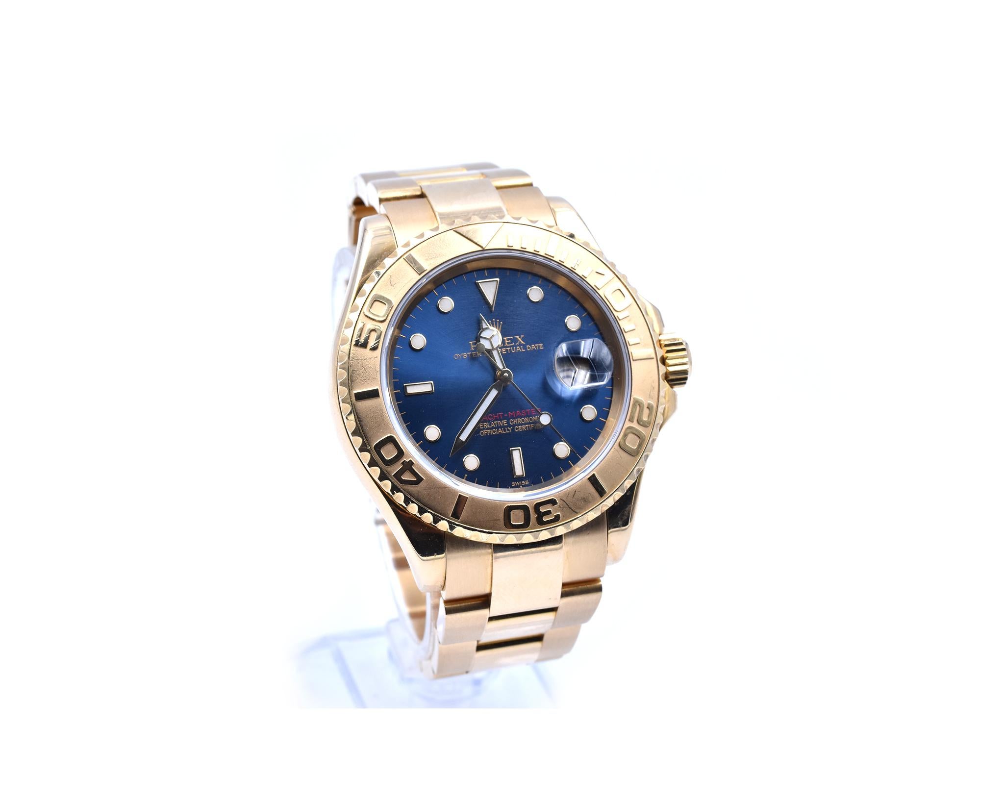 Movement: automatic
Function: seconds, hours, minutes, date
Case: round 40mm 18k yellow gold case, 18k yellow gold bi-directional rotating bezel, scratch resistant sapphire crystal, screw down crown, water resistant to 100 meters
Band: 18k yellow