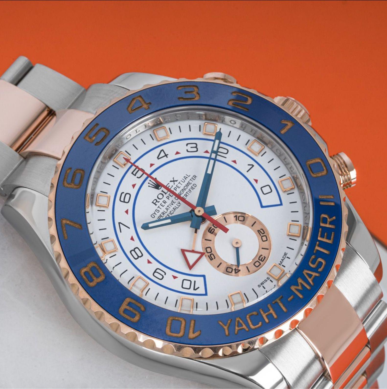 A Rolex Yacht-Master II in Oystersteel and rose gold. Featuring a white dial with a 10-minute countdown and a small seconds display. The rose gold bidirectional rotatable ring command bezel features a blue ceramic insert with numerals coated in