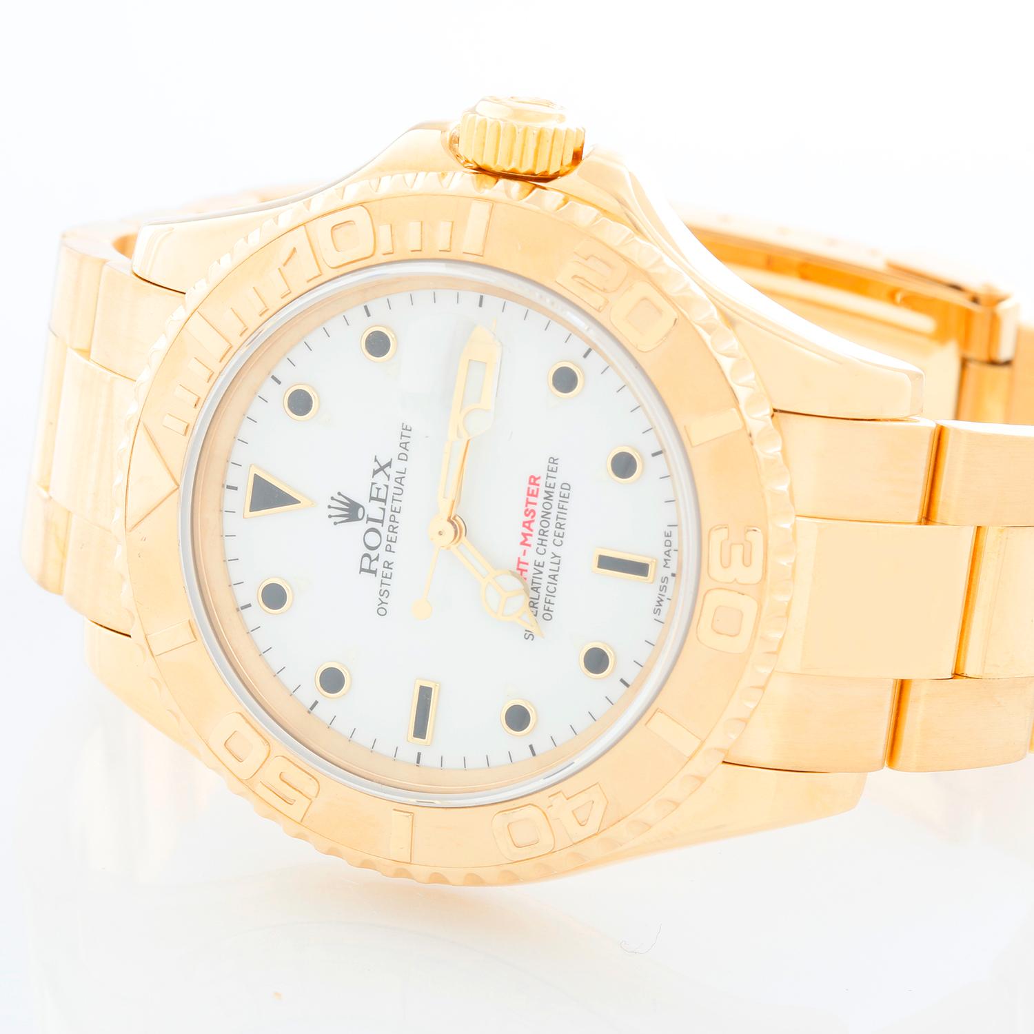 Rolex Yacht-Master Men's 18k Yellow Gold Watch 16628 - Automatic winding, 31 jewels, Quickset, sapphire crystal. 18k yellow gold case (40mm diameter). White dial with black hour markers. 18k yellow gold Oyster bracelet with flip-lock clasp.