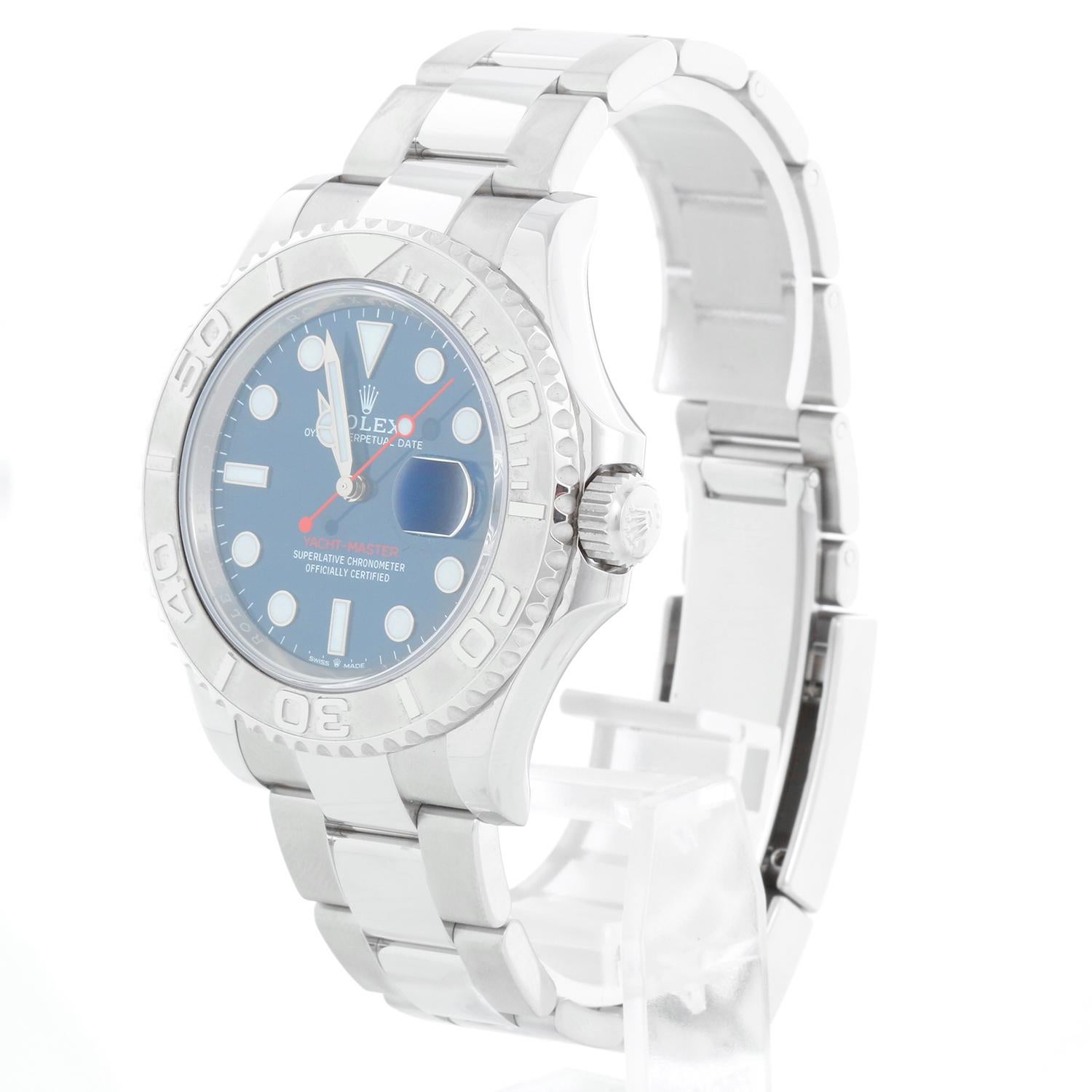 Rolex Yacht-Master Men's Stainless Steel Watch 126622 - Automatic winding, Caliber 3235 movement, Quickset, sapphire crystal. Stainless steel case with platinum bezel  (40mm diameter). Blue dial with luminous markers. Stainless steel Oyster bracelet