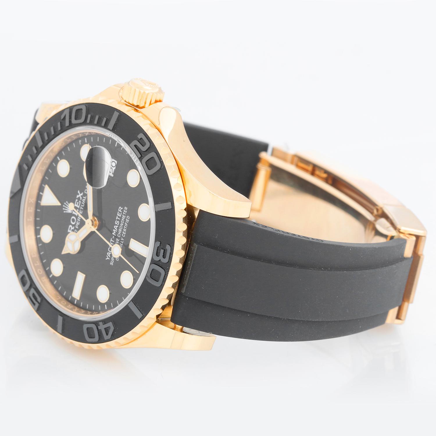 Rolex Yacht-Master Oysterflex 18k Yellow Gold Men's Watch 226658 - Automatic winding. 18k yellow gold case and rotating bezel with black insert (42mm diameter). Black Maxi dial with luminous style white hour markers. Black Rolex Oysterflex rubber