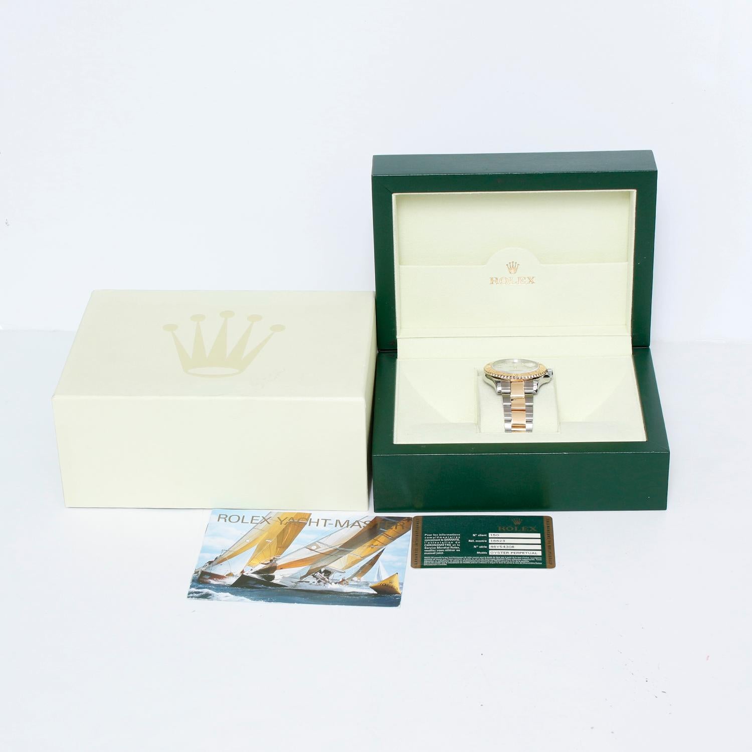 Rolex Yacht-Master Steel & Gold Men's 2-Tone Watch 16623 - Automatic winding, 31 jewels, Quickset, sapphire crystal. Stainless steel case with 18k yellow gold bezel  (40mm diameter).  Slate gray steel dial with luminous style hour markers; date at 3
