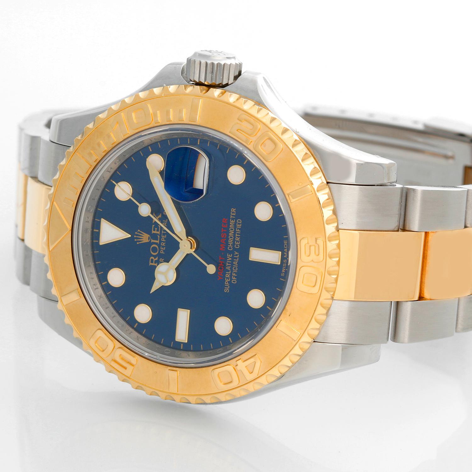 Rolex Yacht-Master Steel & Gold Men's 2-Tone Watch 16623 - Automatic winding, 31 jewels, Quickset, sapphire crystal. Stainless steel case with 18k yellow gold bezel  (40mm diameter). Factory Blue Dial. Stainless steel and 18k yellow gold Oyster