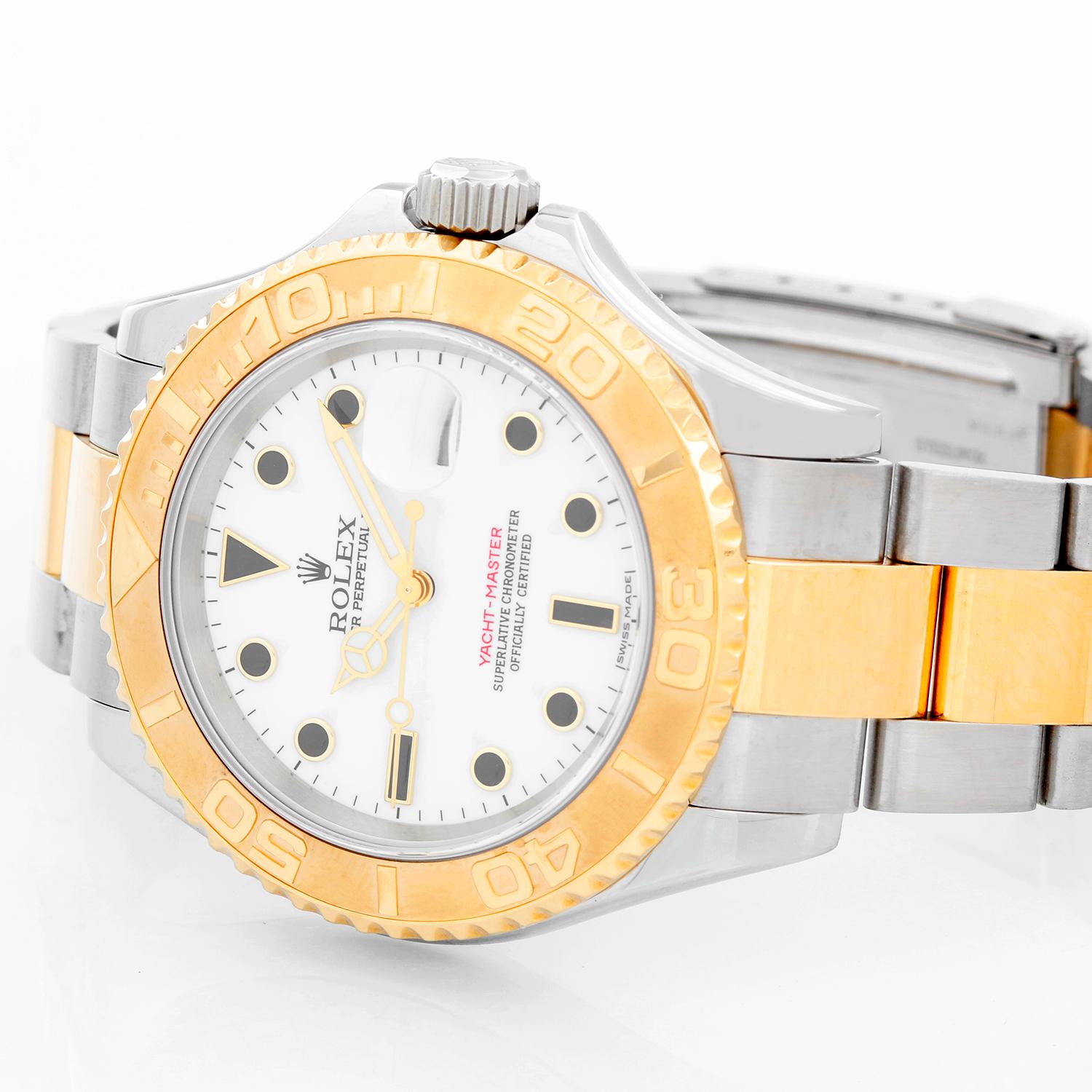 Rolex Yacht-Master Steel & Gold Men's 2-Tone Watch 16623 - Automatic winding, 31 jewels, Quickset, sapphire crystal. Stainless steel case with 18k yellow gold bezel  (40mm diameter). White dial with luminous hour markers . Stainless steel and 18k