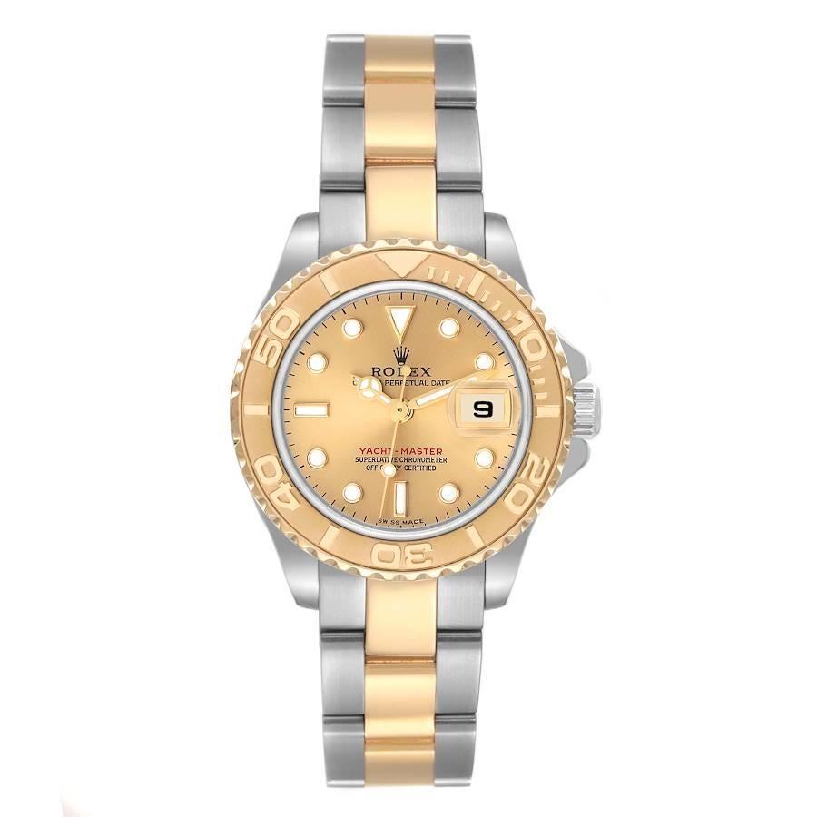 Rolex Yachtmaster 29 Steel Yellow Gold Champagne Dial Ladies Watch 169623. Officially certified chronometer self-winding movement. Stainless steel and 18K yellow gold case 29 mm in diameter. Rolex logo on a crown. 18K yellow gold special time-lapse