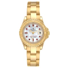 Rolex Montre Yachtmaster 29 en or jaune avec cadran en rubis MOP, pour femmes 169628
