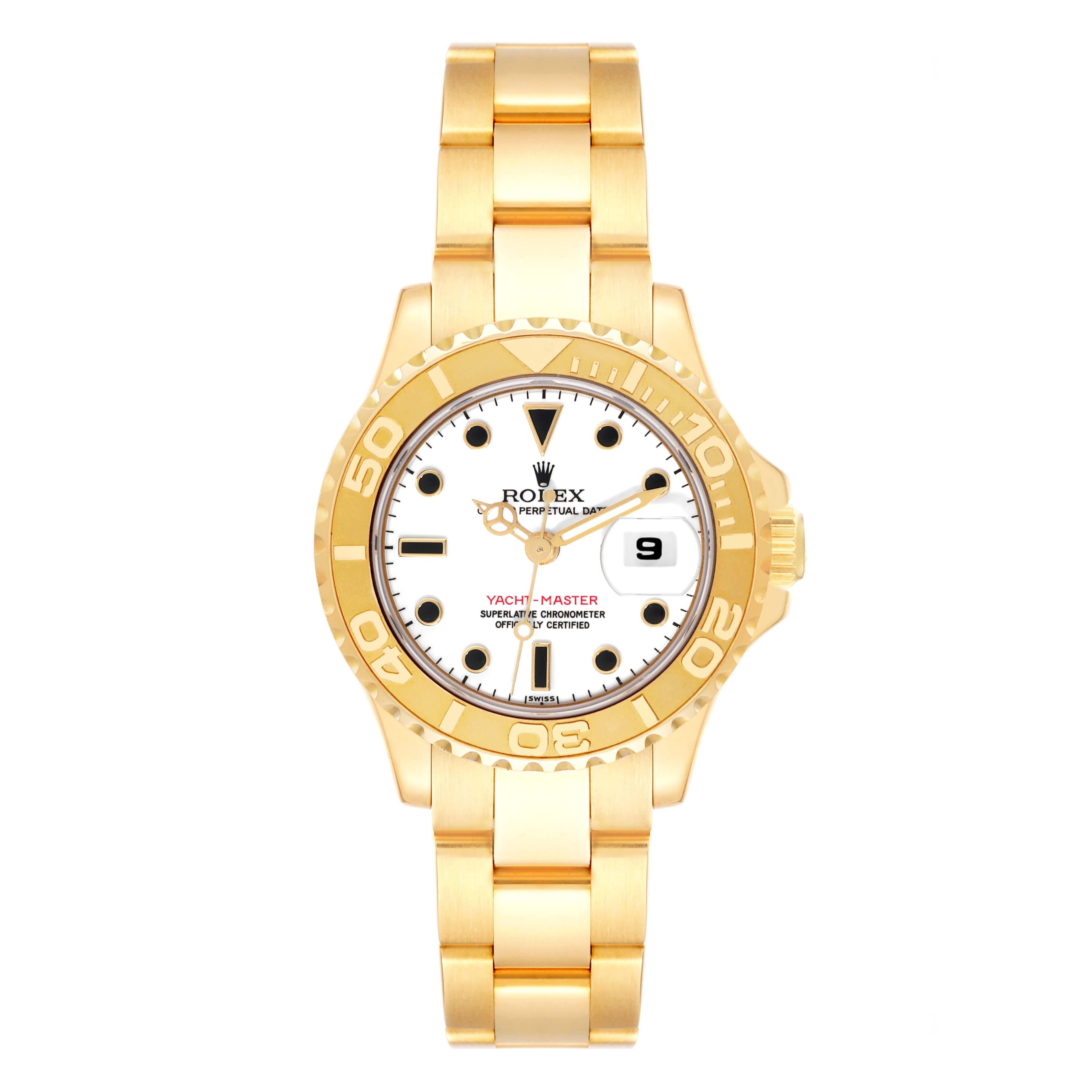 Rolex Yachtmaster 29 Yellow Gold White Dial Ladies Watch 69628. Officially certified chronometer automatic self-winding movement. 18K yellow gold case 29 mm in diameter. Rolex logo on the crown. 18K yellow gold special time-lapse bi-directional