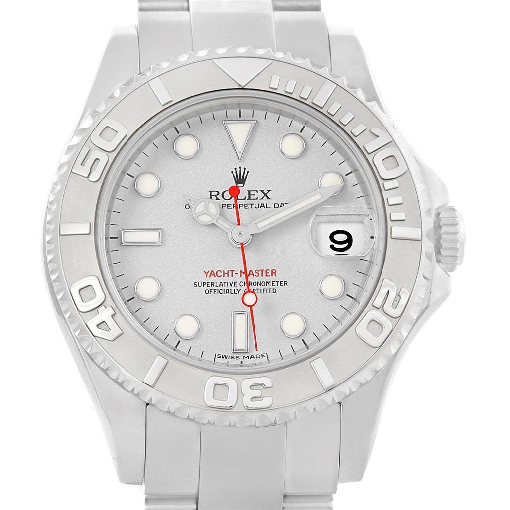 Rolex Yachtmaster 35mm Midsize Steel Platinum Mens Watch 168622. Officially certified chronometer self-winding movement. Stainless steel case 35.0 mm in diameter. Rolex logo on a crown. Platinum special time-lapse unidirectional rotating bezel.