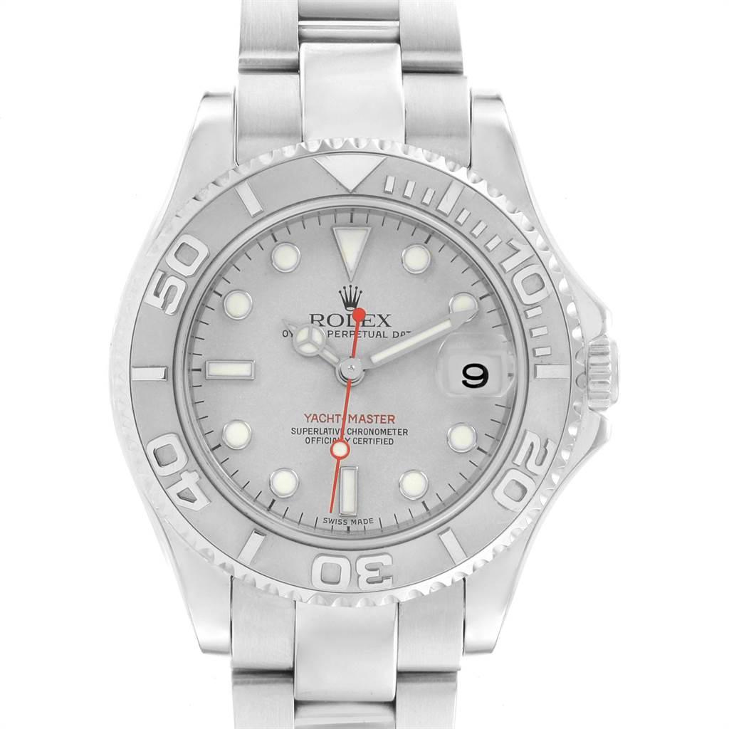 Rolex Yachtmaster 35mm Midsize Steel Platinum Mens Watch 168622. Officially certified chronometer self-winding movement. Stainless steel case 35.0 mm in diameter. Rolex logo on a crown. Platinum special time-lapse unidirectional rotating bezel.