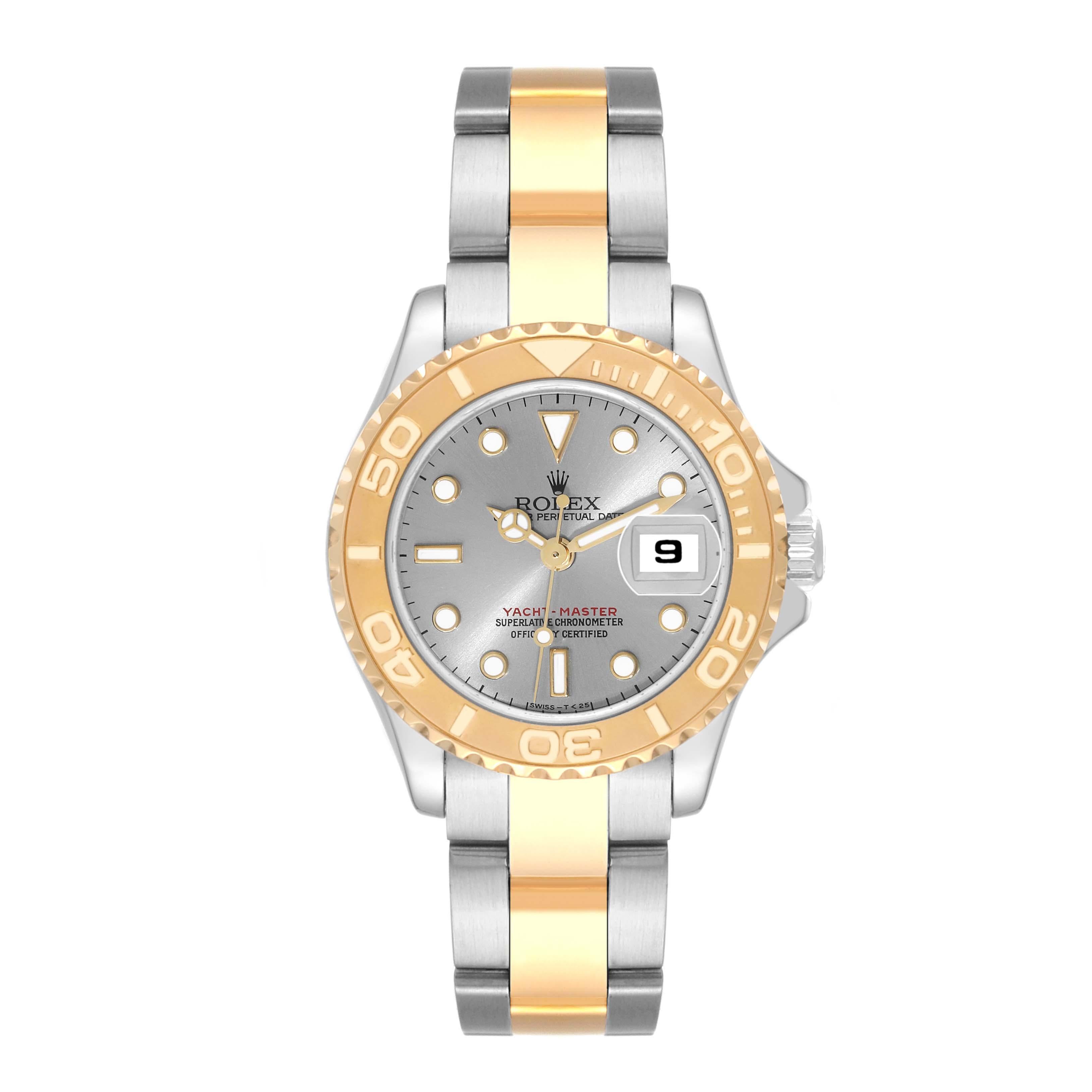 Rolex Yachtmaster Steel Yellow Gold Slate Dial Ladies Watch 69623. Officially certified chronometer self-winding movement. Stainless steel and 18K yellow gold case 29 mm in diameter. Rolex logo on a crown. 18K yellow gold special time-lapse