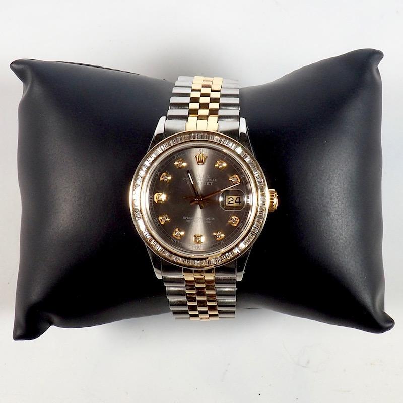 Rolex yellow gold and stainless steel oyster perpetual Datejust 36mm Wristwatch with a jubilee bracelet and custom diamond bezel. A wonderful solid gold customised Rolex of exceptional quality and condition set with baguette cut diamonds.

Technical