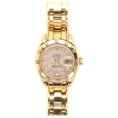 Montre Rolex Pearlmaster en or jaune et diamants pour femmes