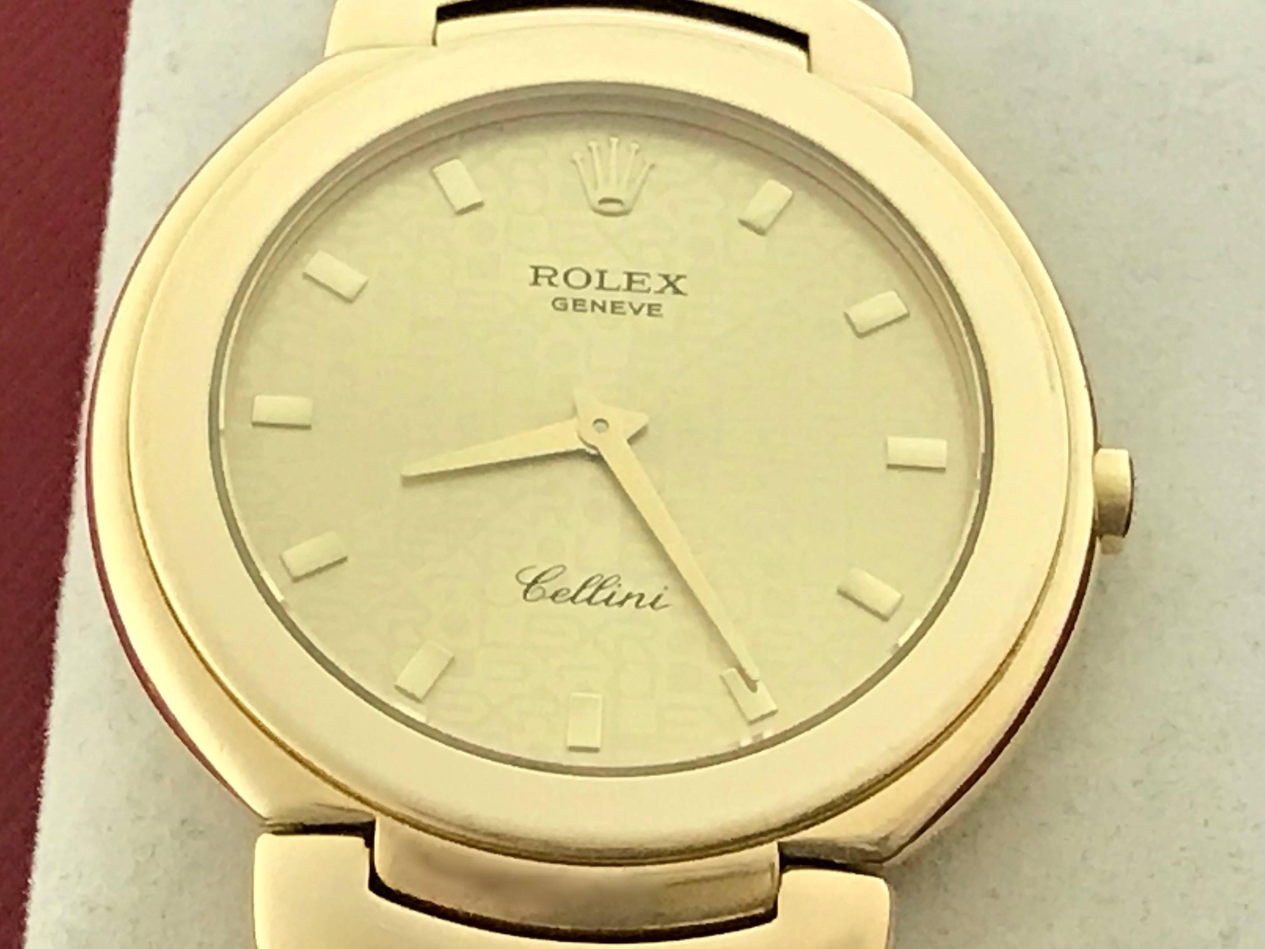 The Rolex Cellini Model 6823/8 pre-owned quartz wrist watch. Featuring a Champagne Rolex Jubilee Dial with yellow gold hour markers. 18k Yellow Gold round style case (36mm). Comes with a strap band and 18k Yellow Gold Rolex deployant clasp, box,