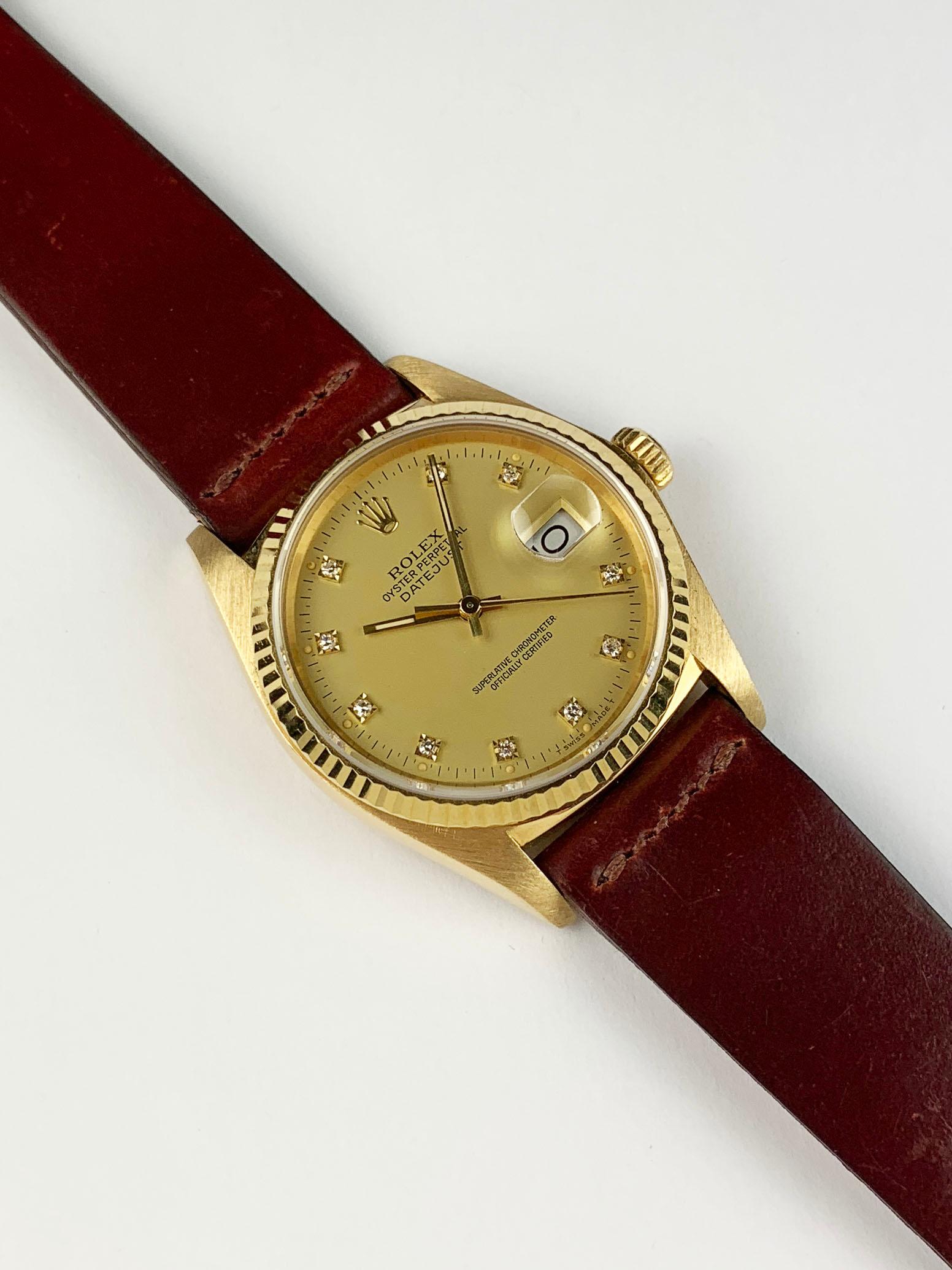Rolex 18K Yellow Gold Oyster Perpetual Datejust Wristwatch
Factory Champagne Diamond Dial with  Colored Lume Plots
18K Yellow Gold Fluted Bezel
36mm in size 
Rolex Calibre Base 3035 Automatic Quick-Set Movement
Sapphire Crystal
1980's