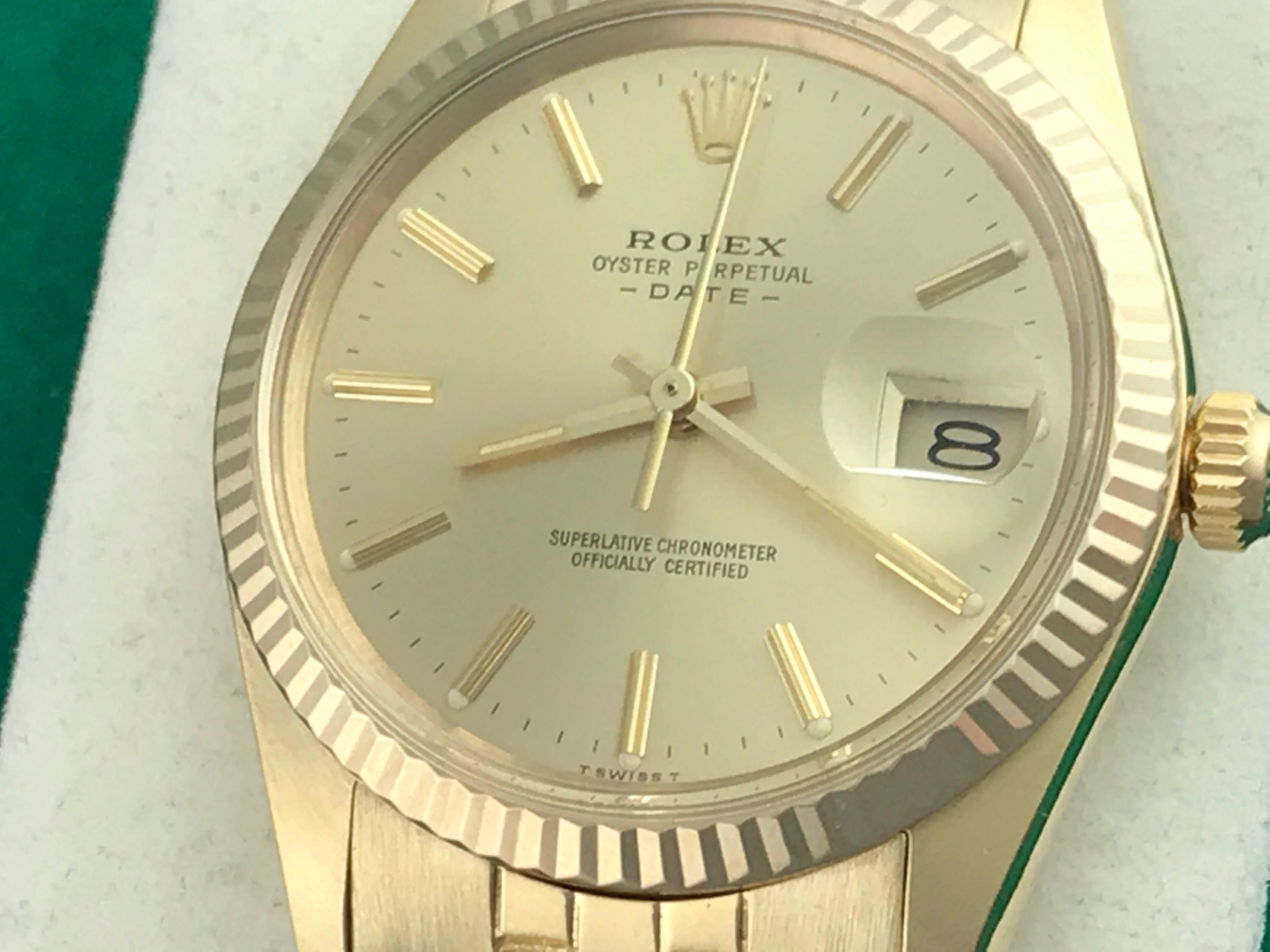 The Rolex Date Model 15037 14k yellow gold pre-owned men's automatic wrist watch. Featuring a champagne dial with yellow gold hour markers and 14k Yellow Gold case. Measures 34mm. Comes with a 14k yellow gold jubilee bracelet.  Box, instruction