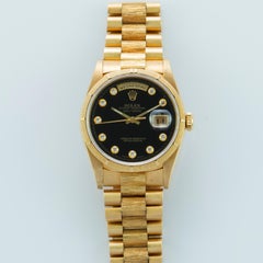 Rolex Yellow Gold Day-Date Black Onyx Serti Dial President Watch, Box and Papers