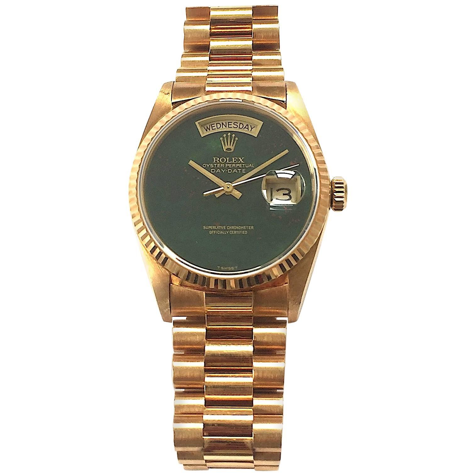 Rolex 18K Yellow Gold Day-Date Presidential Watch
Rare Factory Rolex Bloodstone Heliotrope Dial without Hour Markers
Bloodstone Is One Of The Rarest Rolex Stone Dials Produced
The Dial  Has a Small Crack Seen with A Loupe and Under Magnification at