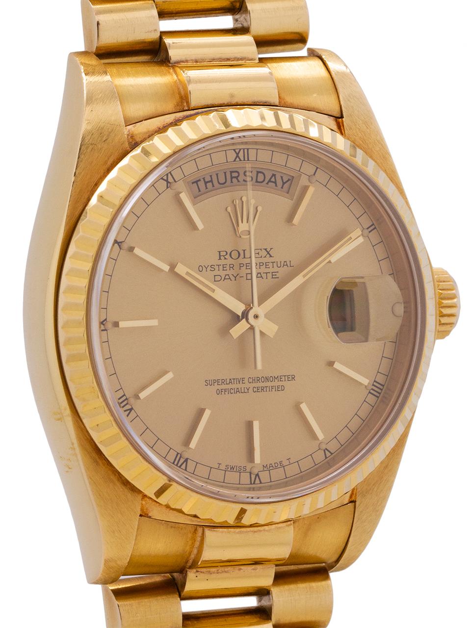 
Rolex ref# 18038 18K YG Day Date President serial# 6.6 million circa 1981. Featuring 36mm diameter full size man’s model with sapphire crystal and fluted bezel, with clean original champagne dial with applied gold indexes and gold baton hands.