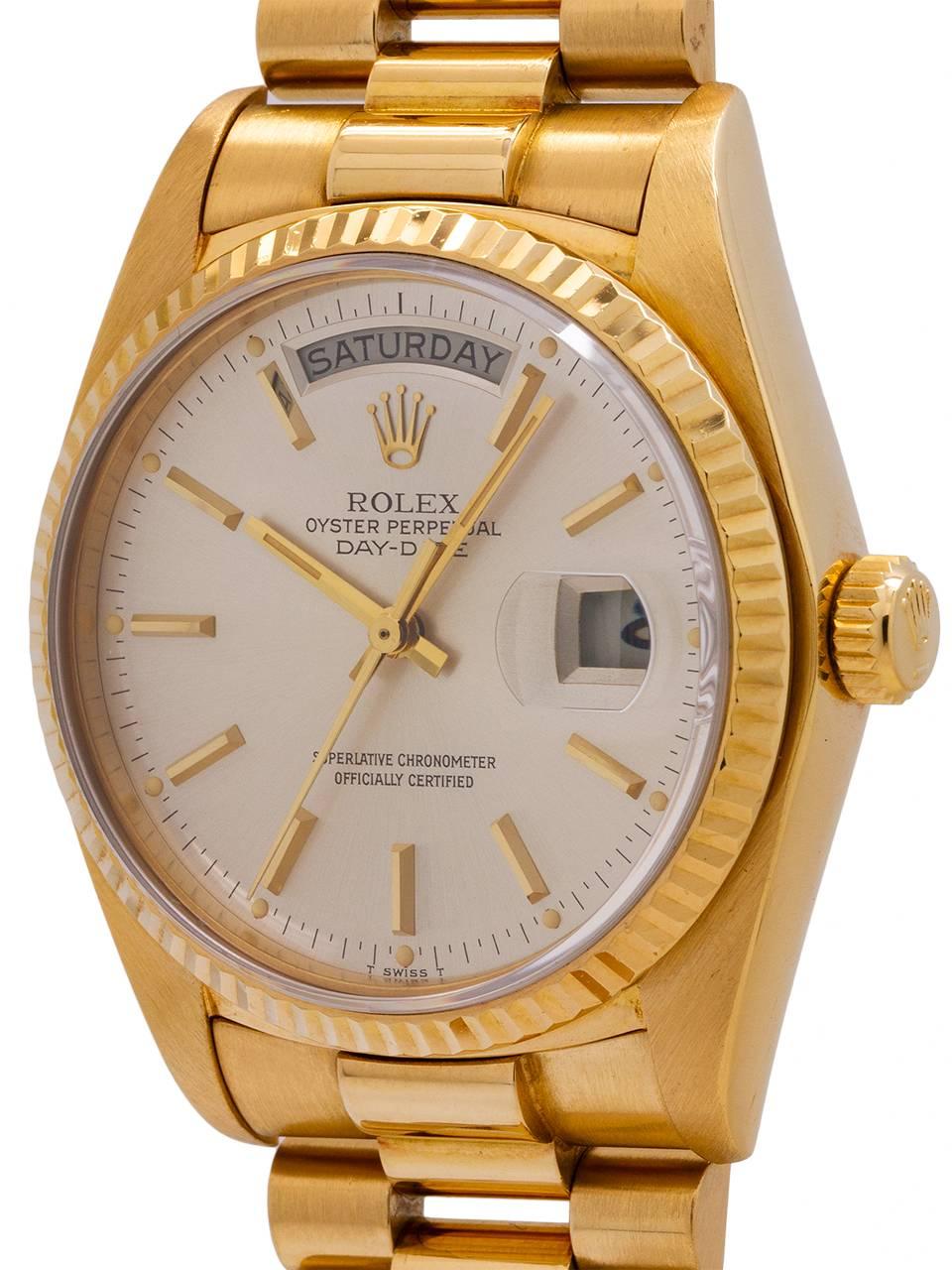 
Rolex ref# 18038 18K YG Day Date President circa 1982. 36mm diameter full size man’s model with sapphire crystal and fluted bezel, with original silvered satin dial with applied gold indexes and gold baton hands. Powered by calibre 3155 movement