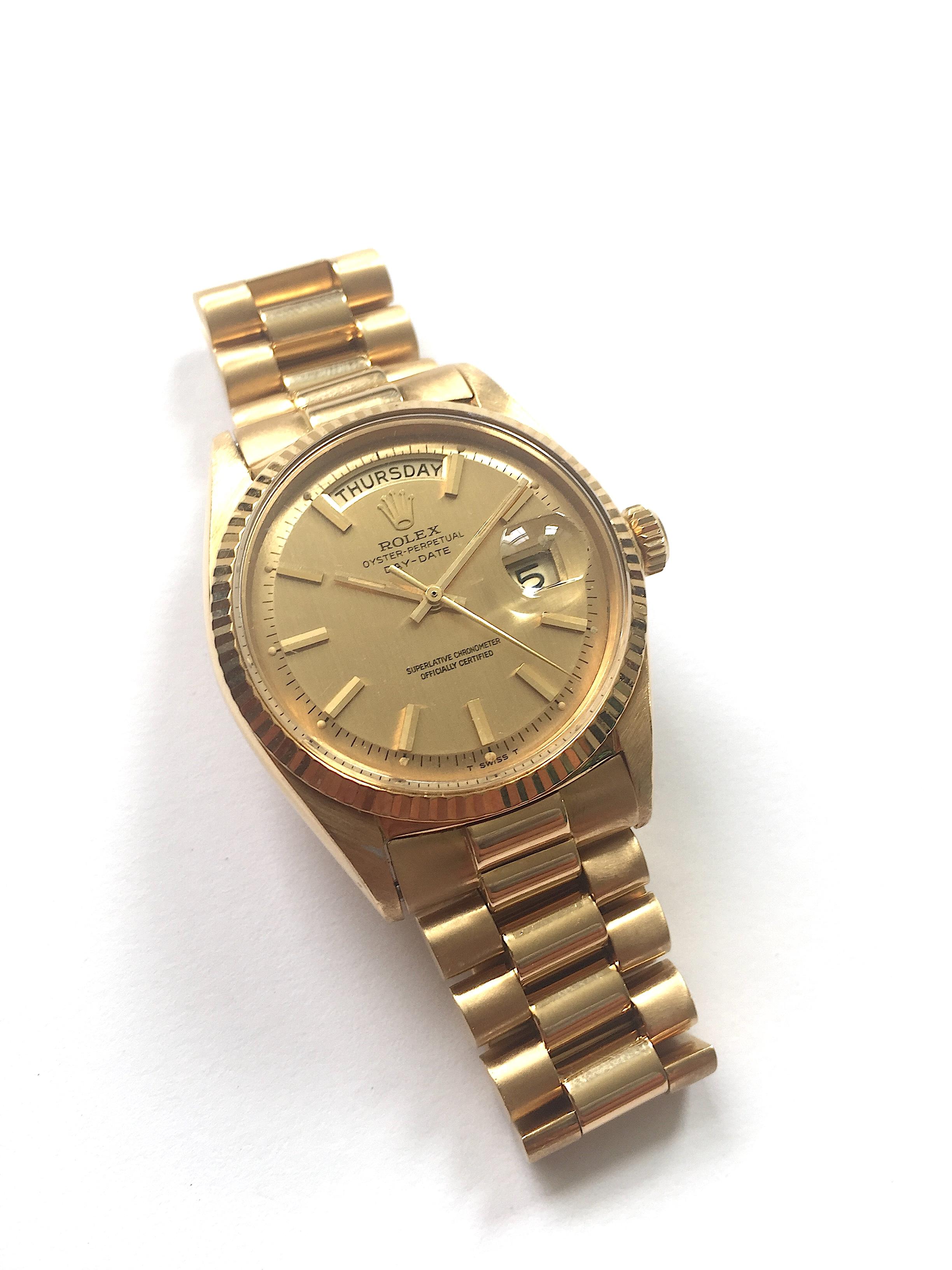 Rolex 18K Yellow Gold Oyster Perpetual Day-Date Automatic Watch
Rare Factory Champagne Shantung Dial
The Shantung Dial name is Derived from The Silk Woven Pattern of The Lines on The Dial.
Yellow Gold Gold Fluted Bezel
18K Yellow Gold Case
36mm in