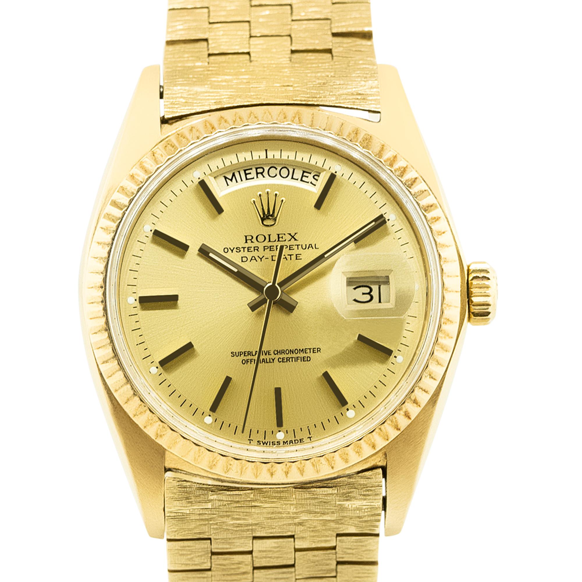 Brand: Rolex
Model: Day-Date
Serial: 2mill
Reference: 1803
Case Material: 18k Yellow Gold
Movement: Automatic
Case Measurement: 36mm
Dial: Gold dial with Spanish day (factory)
Crystal: Plastic Crystal
Bracelet: Rare 18k Yellow Gold Bark