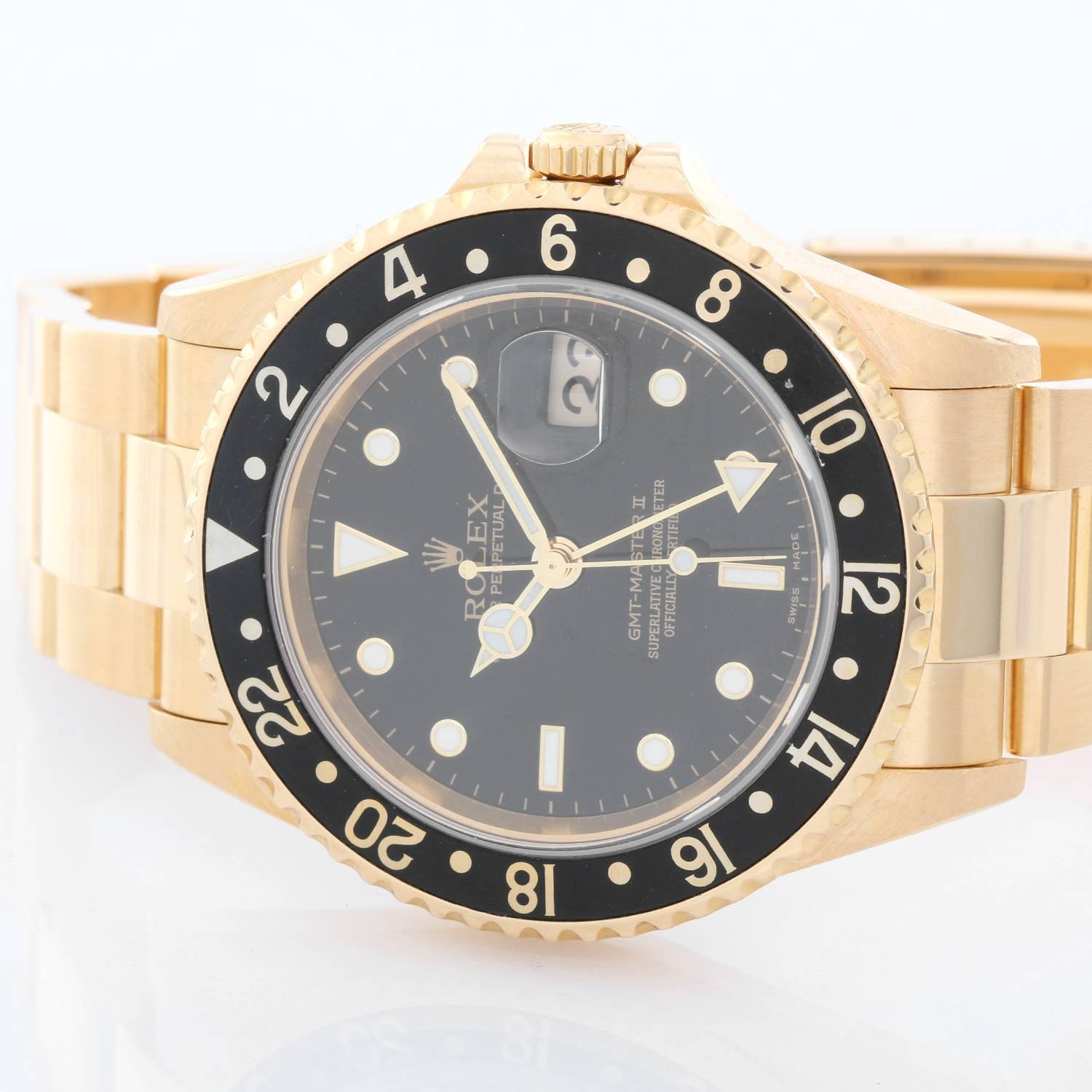 Rolex GMT-Master II 18K Yellow Gold Men's Watch 16718 -  Automatic winding, 31 jewels, Quickset, sapphire crystal. 18k yellow gold case with rotating bezel (40mm diameter). Black dial with luminous markers. 18k yellow gold Oyster bracelet. Pre-owned
