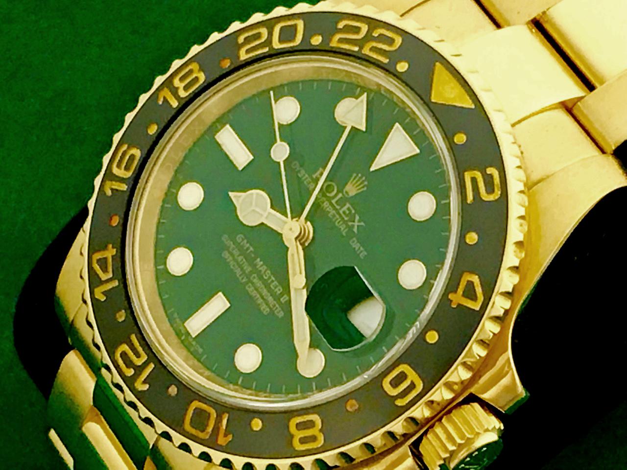Rolex Men's GMT-Master II Anniversary Model 116718LN at a great price.  Automatic Winding Oyster Perpetual with Date Movement.  Featuring a stunning green dial with luminous markers,  18k yellow gold case with rotating bezel and black ceramic bezel,