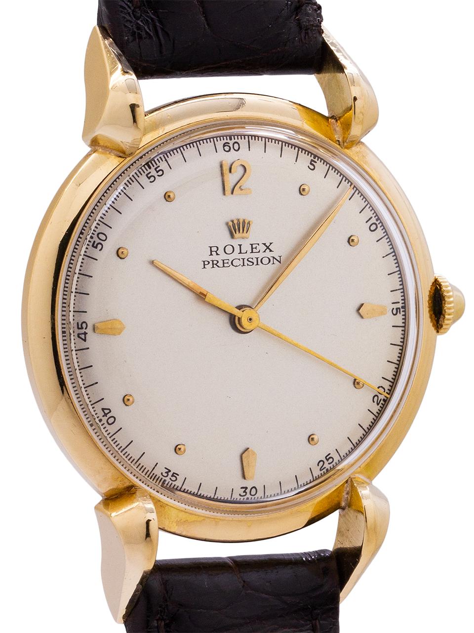 
Rolex 18K yellow gold dress manual wind dress model ref # 4514 circa 1950s. Featuring a 34 x 45mm heavy snap back case with pronounced raised grasshopper lugs. With very pleasing restored matte silver dial with gold applied figures and gilt baton