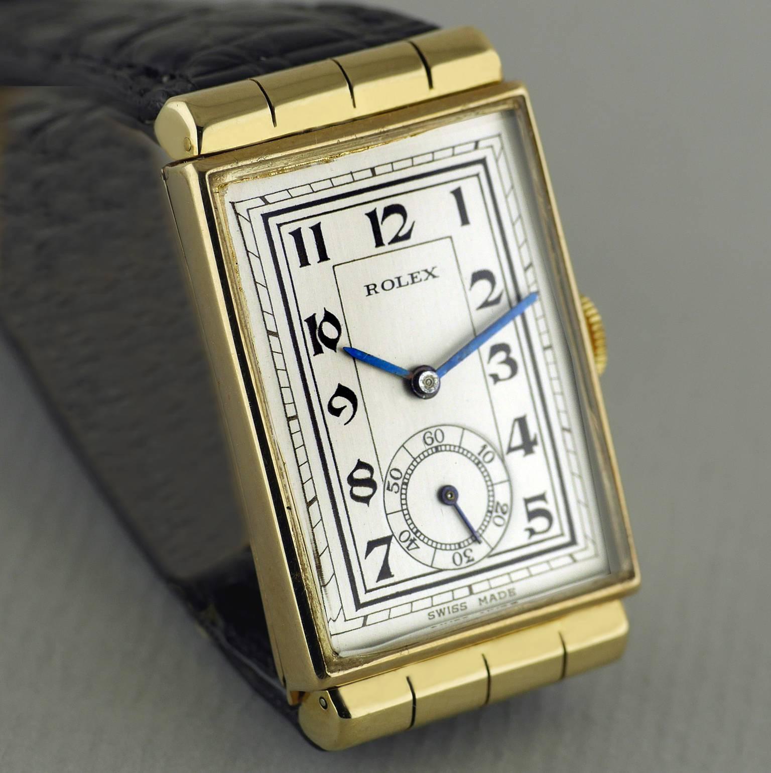 An Art Deco vintage wristwatch by Rolex made in 1937.

Gold case with rare and unusual hooded lugs, marked “RWC LTD” for the Rolex Watch Company Ltd  and “27 Records Universels”. Hallmarked for Glasgow import into the United Kingdom in 1937. Snap