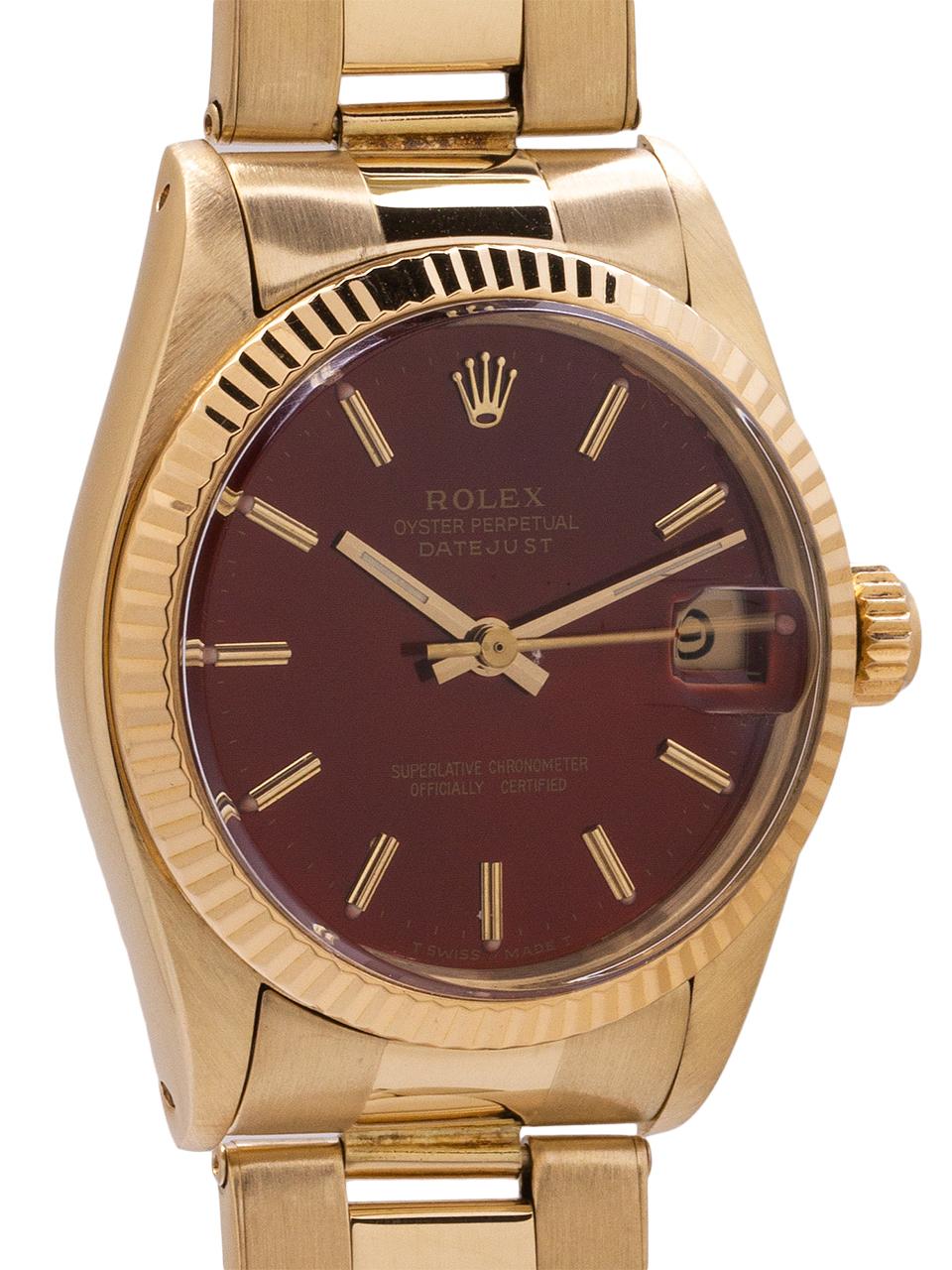 
Rolex midsize Datejust 14K YG ref 6827 circa 1982. Featuring 31mm diameter case with smooth bezel, acrylic crystal and custom colored “Rootbeer” color dial with applied gold indexes and gold baton hands. Powered by self winding movement with sweep