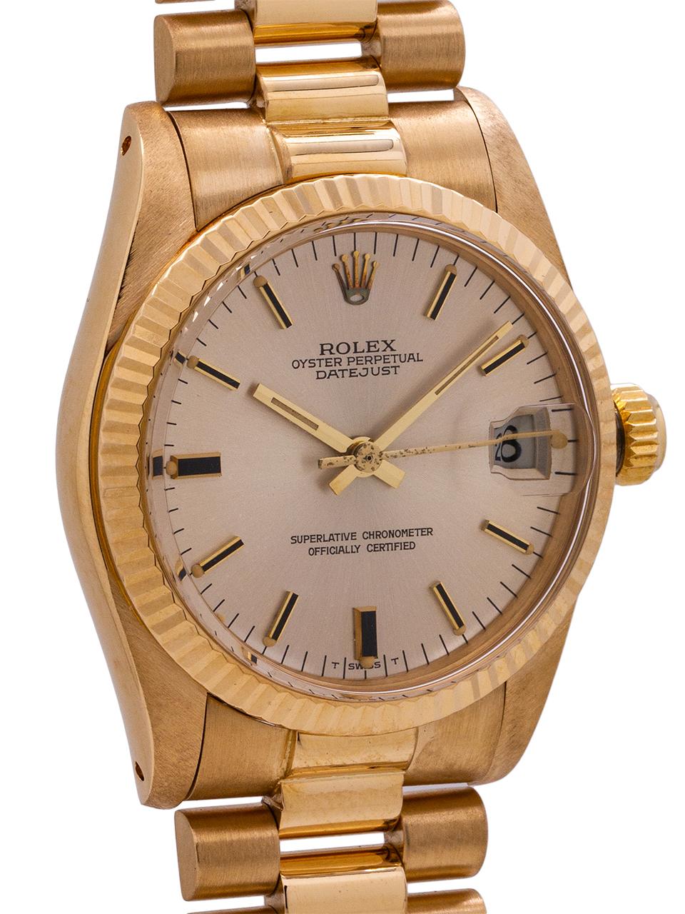 Rolex midsize Datejust 18K YG ref 6828, serial # 6.2 million circa 1979. Featuring a 31mm diameter yellow gold case with fluted bezel in exceptionally mint condition. With acrylic crystal and original matte silvered dial with applied gold  indexes,