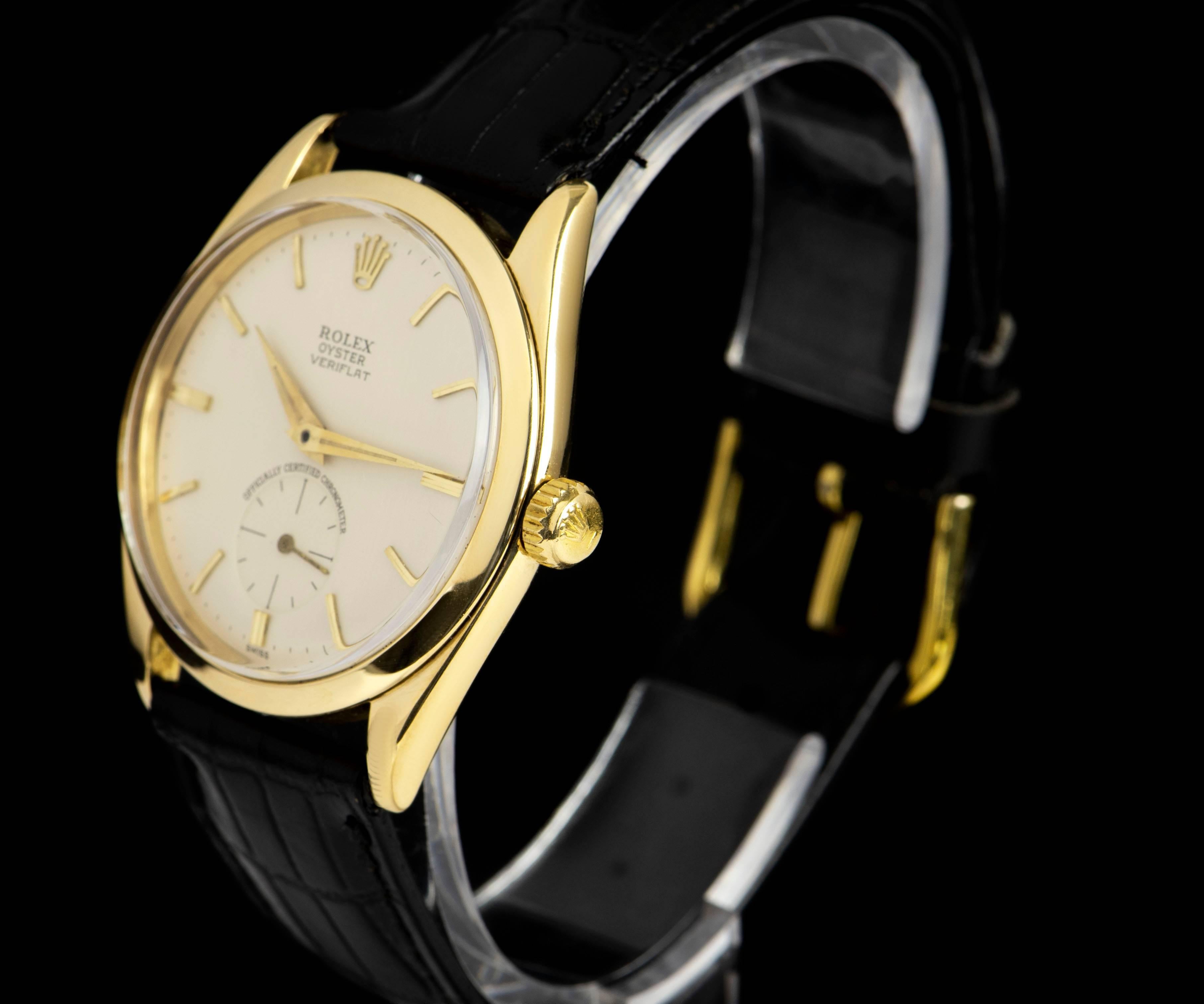 An 18k Yellow Gold Oyster Precision Veriflat Vintage Gents Wristwatch, silvered dial with applied hour markers, small seconds at 6 0'clock, a fixed 18k yelllow gold smooth bezel, a black leather strap with a gold plated pin buckle (both not by
