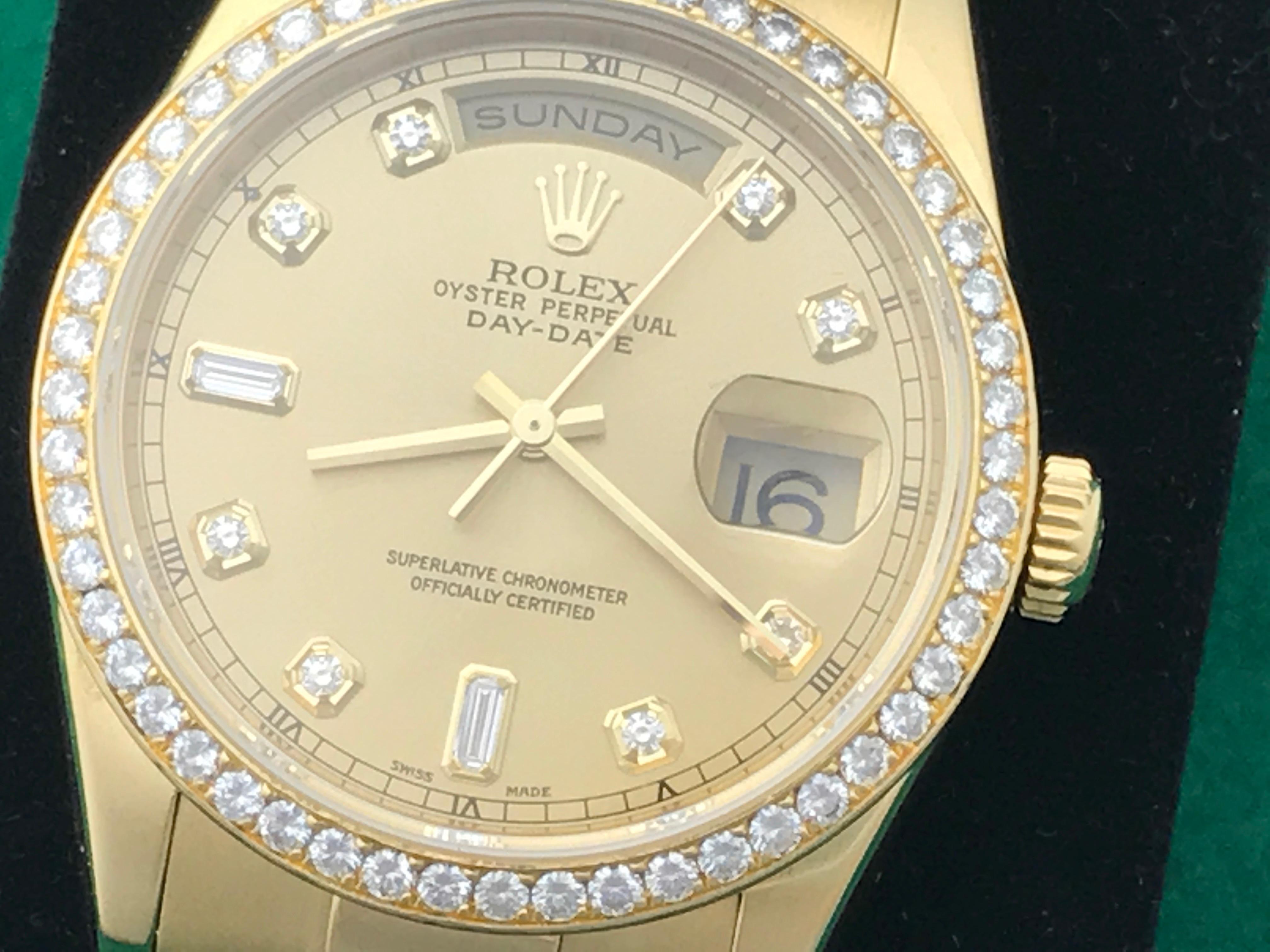 Rolex President Day-Date Model 118348 Pre Owned Mens Automatic wrist watch. Champagne Diamond Dial with Rolex Diamond hour markers. 18k Yellow Gold case with Rolex Diamond bezel (35mm). 18k Yellow Gold hidden clasp President bracelet. Rolex box and