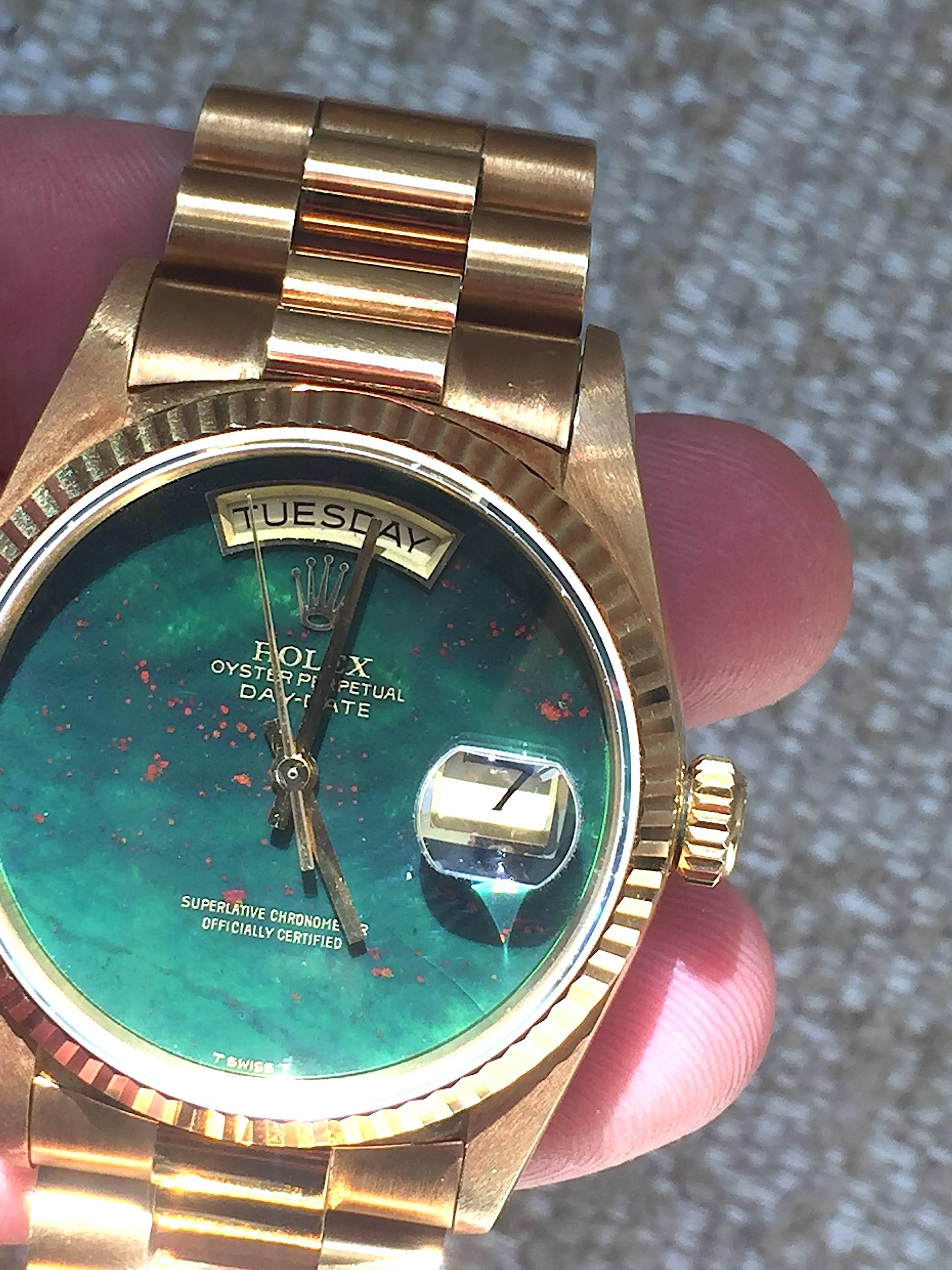 Rolex 18K Yellow Gold Day-Date Presidential Watch
Rare Factory Rolex Bloodstone Heliotrope Dial without Hour Markers
Bloodstone Is One Of The Rarest Rolex Stone Dials Produced
The Dial  Has a Small Crack Seen with A Loupe and Under Magnification at