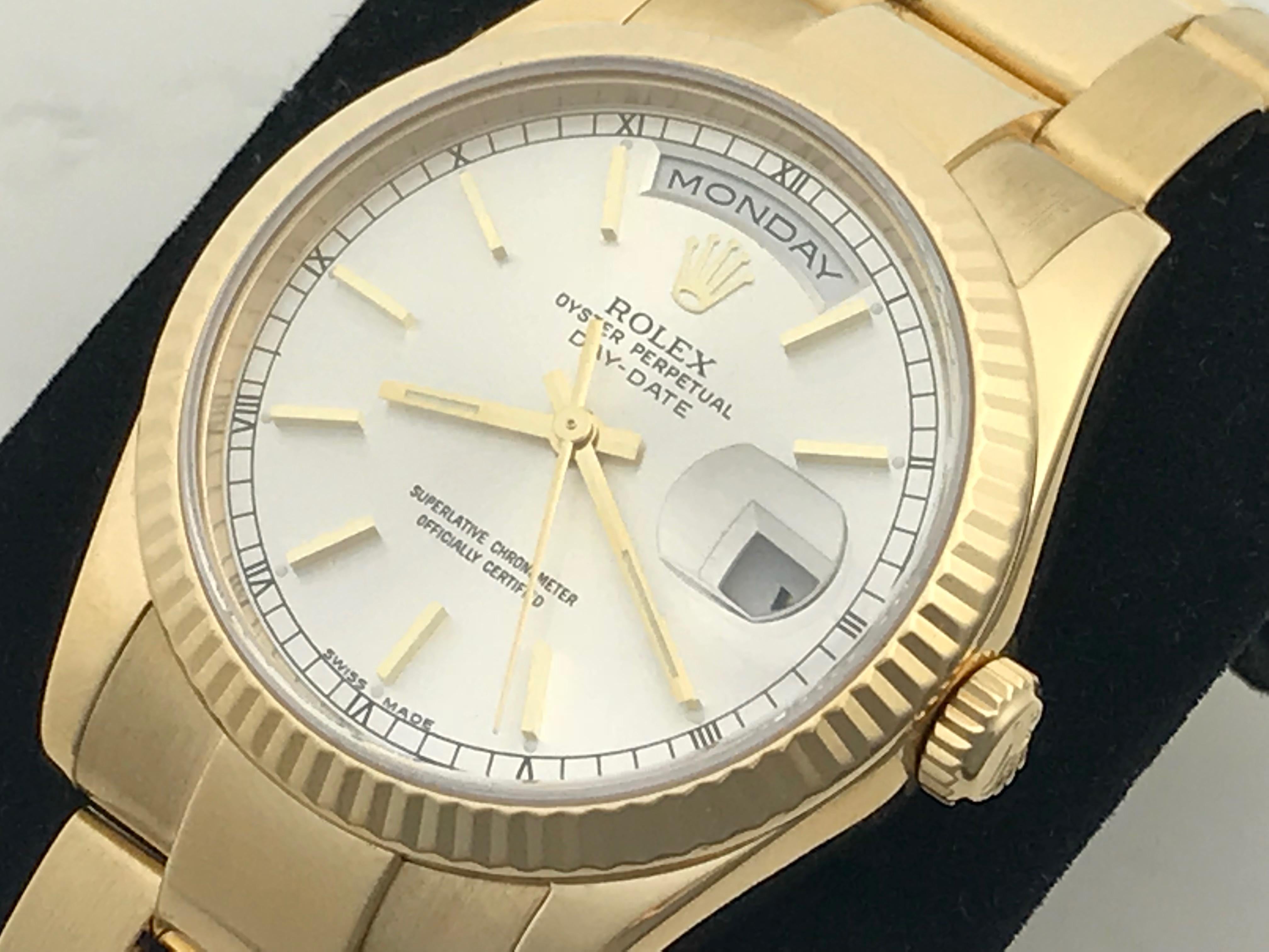 Rolex President Day-Date Model 118238 Pre Owned Mens  Automatic wristwatch. Oyster Silvered Dial with gold hour markers. 18k Yellow Gold case with fluted bezel (36mm). 18k Yellow Gold Oyster President bracelet. Rolex box and instruction booklet