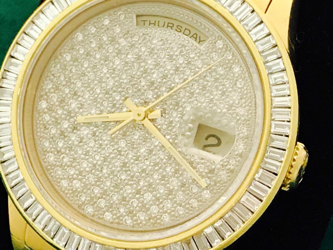 Rolex President Day-Date Model 18238 Pre Owned Mens  Automatic wrist watch. Rolex Full Pave Diamond Dial. 18k Yellow Gold case with custom 3.5 ct. baguette Diamond bezel (35mm). 18k Yellow Gold hidden clasp President bracelet with 15 custom Diamonds