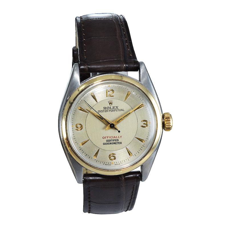 FACTORY / HOUSE: Rolex Watch Company
STYLE / REFERENCE: Oyster Perpetual / Ref. 6084
METAL / MATERIAL: Two Tone / 14Kt. & Stainless Steel 
DIMENSIONS:  39mm  X  34mm
CIRCA: 1950/51
MOVEMENT / CALIBER: Perpetual Winding / 19 Jewels / Cal. 645
DIAL /