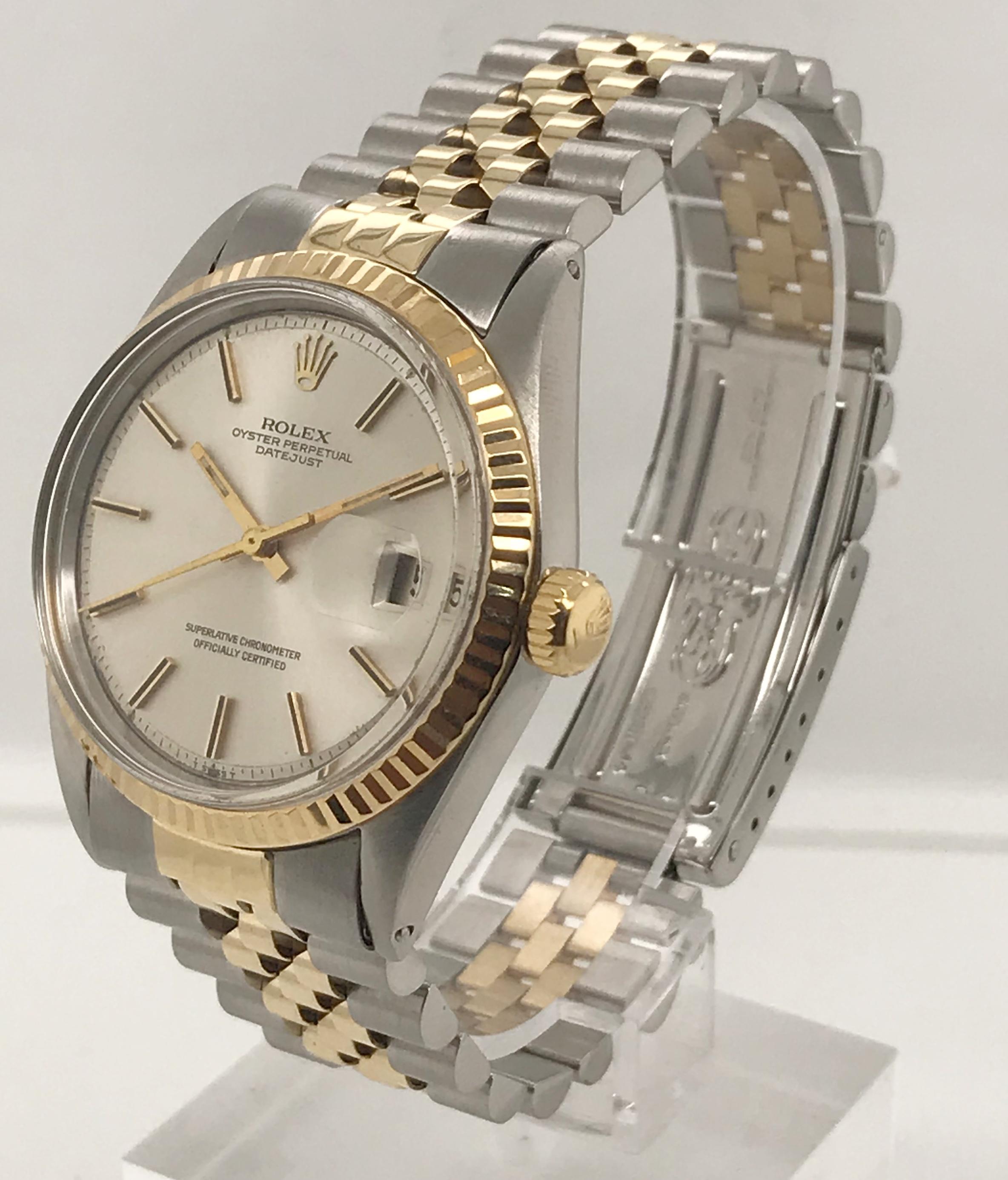 36mm Rolex Datejust with Pie-Pan style Silvered Dial and Fluted Bezel. This timepiece is crafted from 18kt yellow gold and stainless steel. The bracelet is a Rolex Jubilee link. Circa 1970.

Serial Number - 2****** 
Model Number - 1601

This