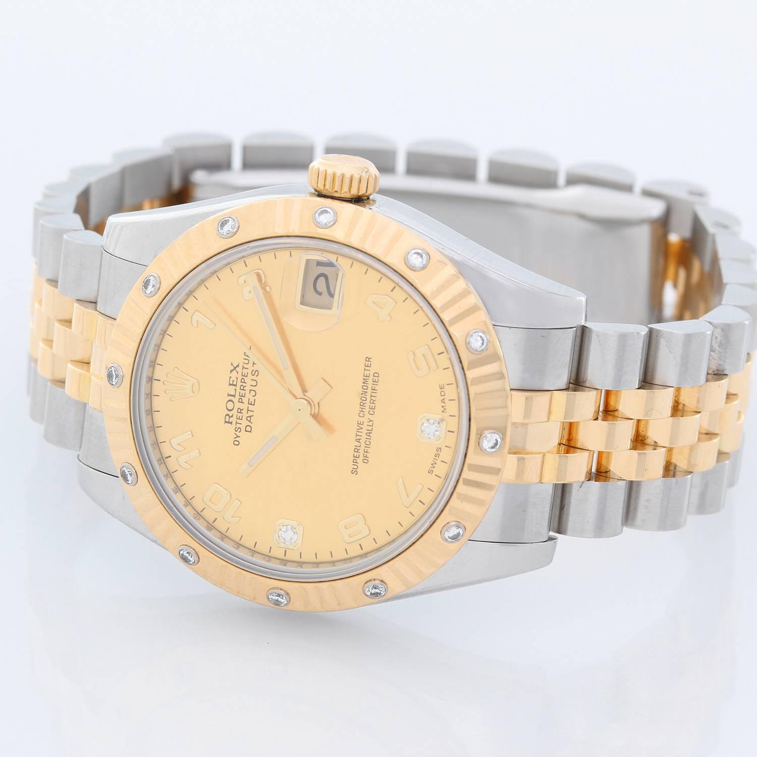 Rolex Midsize 2-Tone 12 Diamond Bezel Datejust Men's/Ladies Watch 178313 - Automatic winding, 31 jewels, sapphire crystal. Stainless steel case with factory 12 diamond bezel. Champagne factory diamond dial with gold Arabic numerals. Stainless steel
